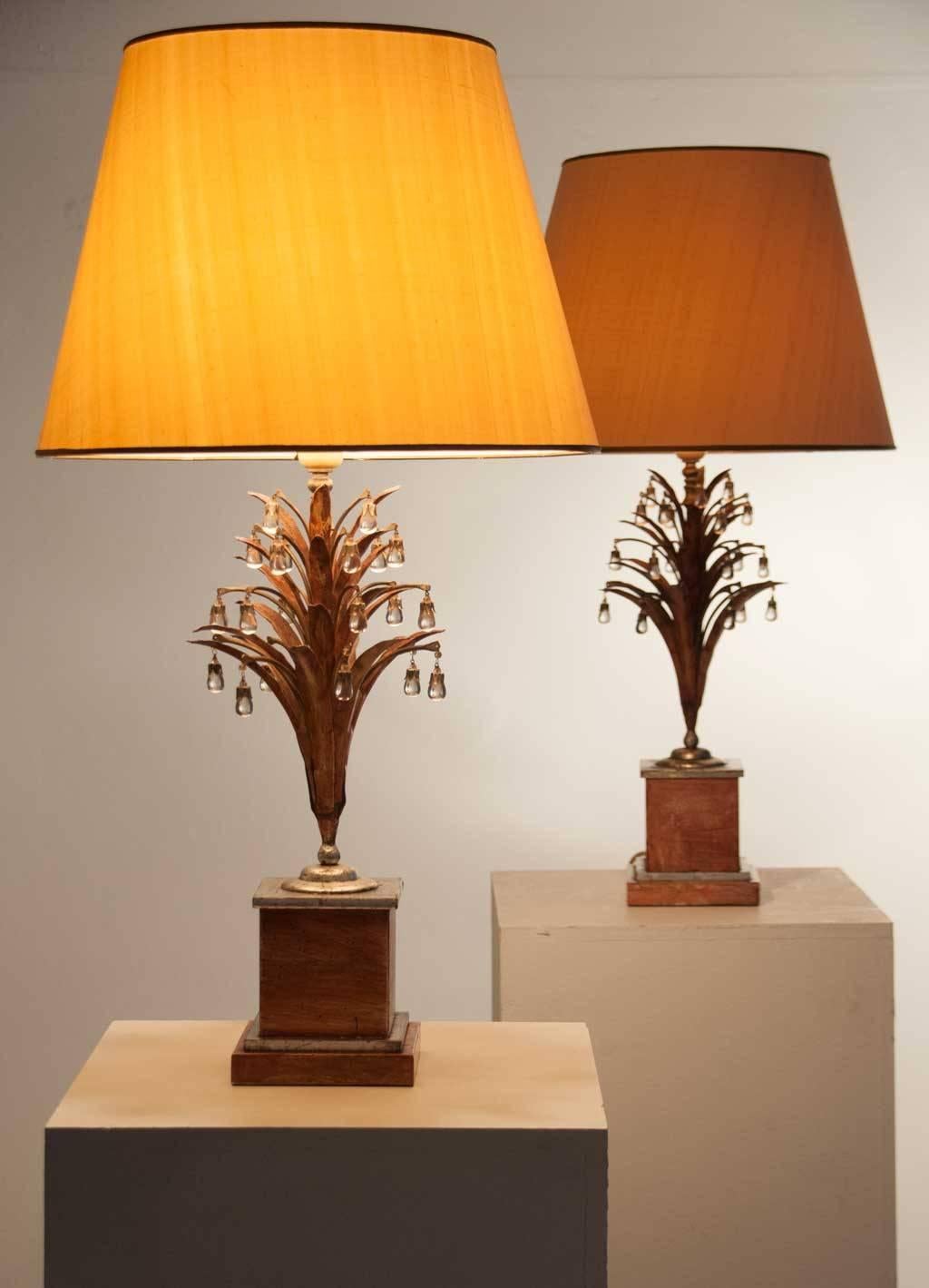 Rare table lamps attributed to Banci. Massive polychrome and silver plated stand with tree-like stem. Hanging from the 'leaves' beautiful mountain crystal drops. Quite majestic table lamps. 
Measurements below are without the lampshade. Height with