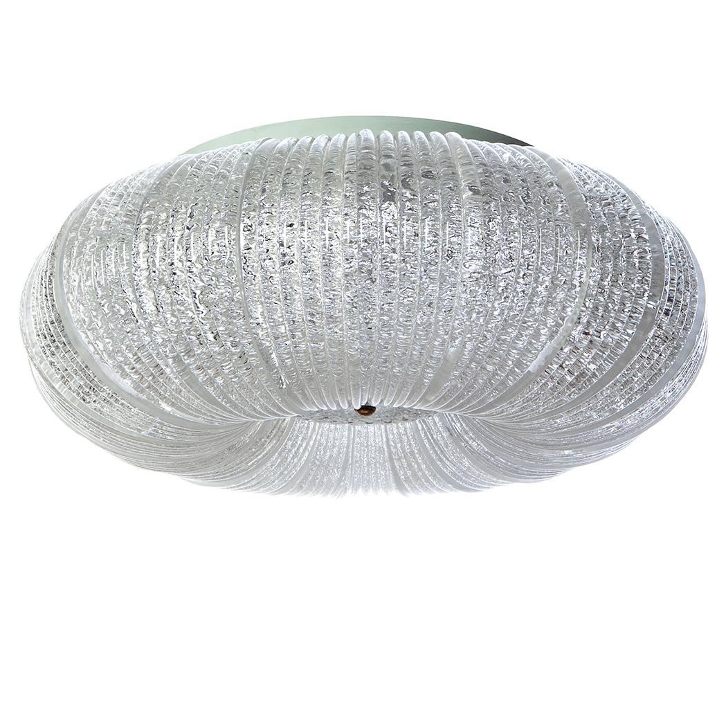 Stunning flush mount attributed to Venini, Beautifully curved and ribbed glass panels, holds six bulbs. With its 19 panels and one lower disk it is an eyecatcher for the room.