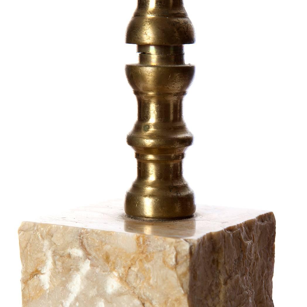 Solid pair of table lamps by Antonio Matias da Rocha & Irmãos, Lda. Unpolished and polished Portugal marble trunk and brass finish. With its rough feel and heavy weight it gives a majestic look.
Note: The lamp owns a company sticker under the foot