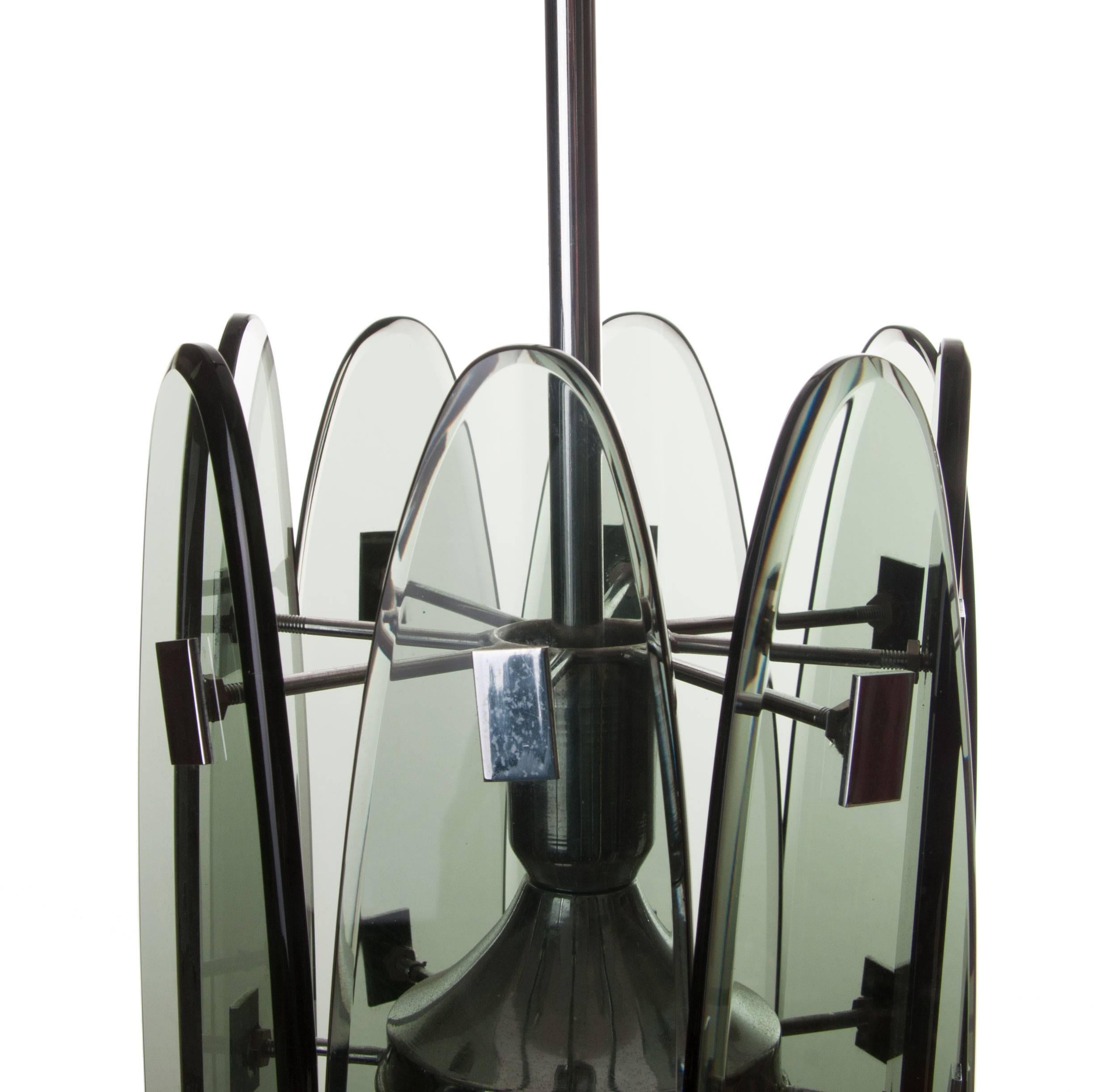 Playful two-light lantern with eight gray collored plates attached to a chrome centre. Each glass plate is attached to the centre with two chrome bars, one before the other.
Manufactured circa 1970s and in good condition.