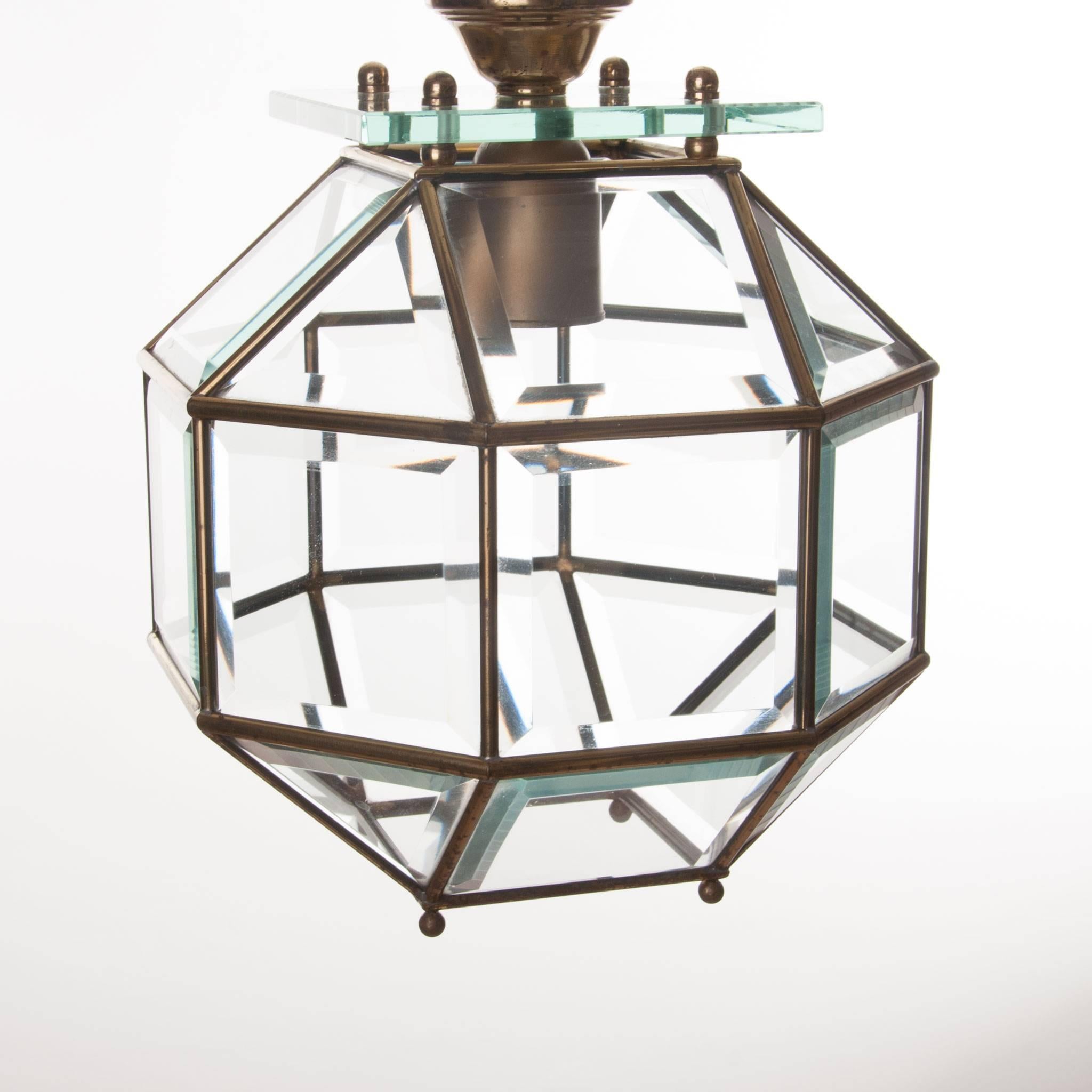 Stylish lantern consist of a brass frame with cut crystal glass, hanging from a thick square glass plate. Great feature! 
Manufactured, circa 1950s.