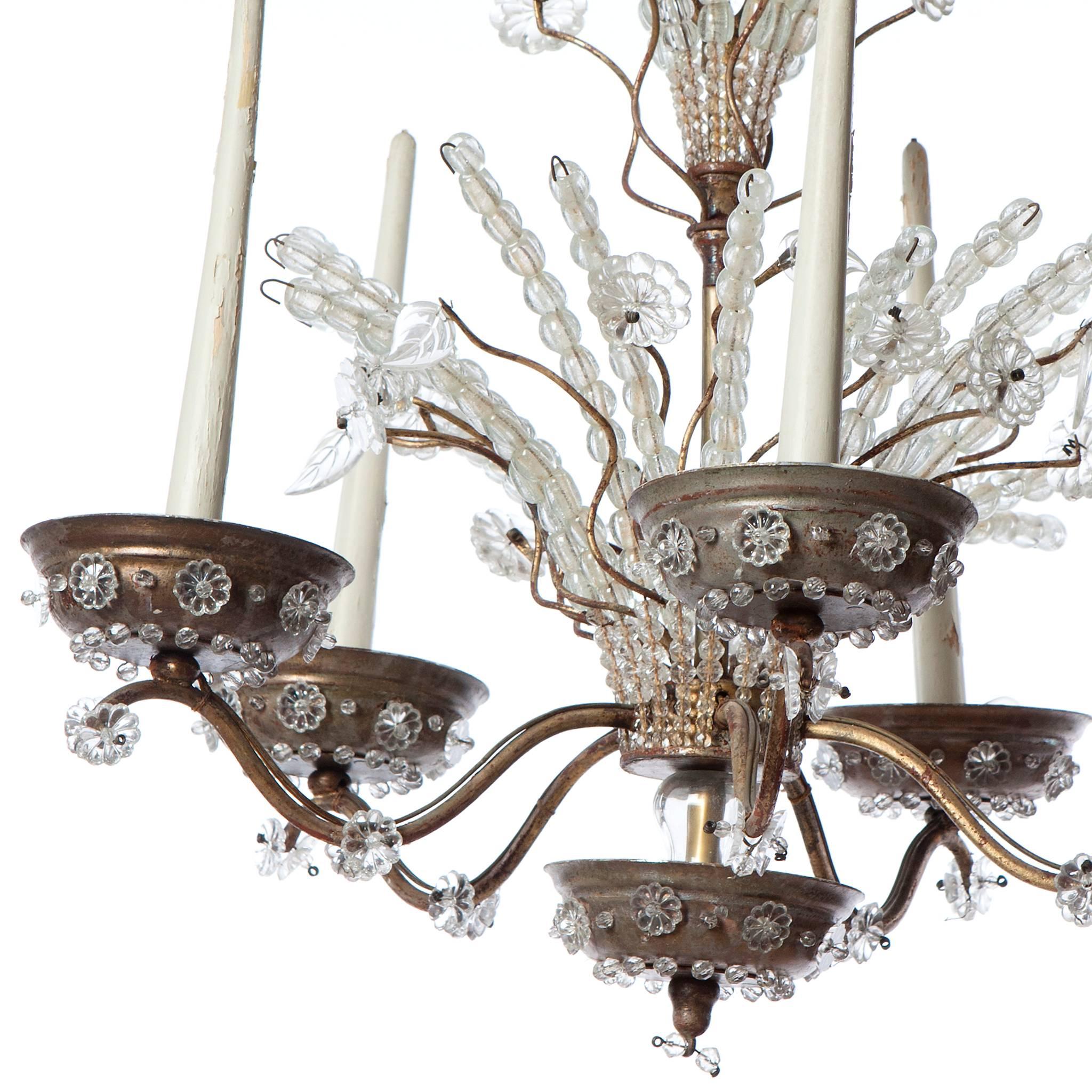 Stunning silver-plated brass and mountain crystal chandelier from 1920s. It holds 10 lightbulbs.  Attributed to Maison Baguès.