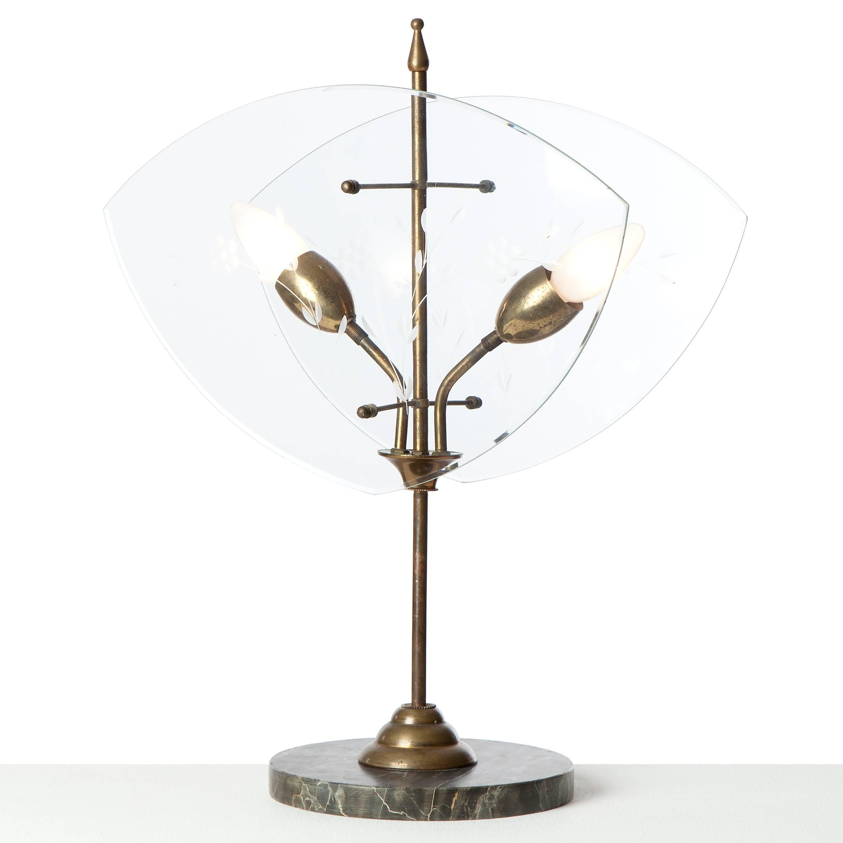 Early (attributed to) Fontana Arte two-light table lamp, with a brass stem. Flanked by two glass-plates etched with a floral motif. The lamp is in vintage condition, there is a small scratch to be found only to be seen from very close.