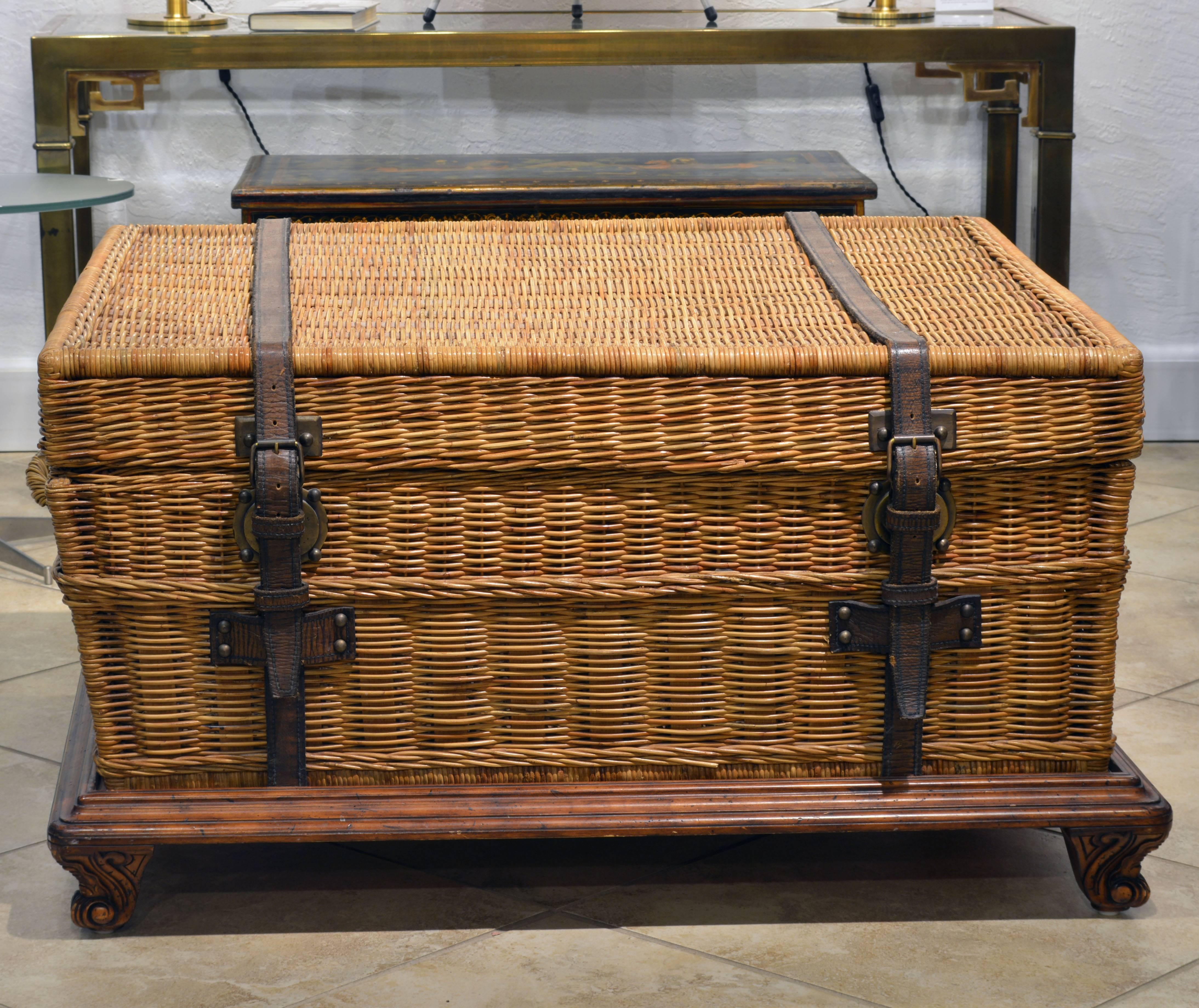 The worldly ambiance of the colonial times comes through in this great design by Ralph Lauren. The woven wicker trunk is raised on a low wooden chinoiserie style base to further accent the exotic reference.