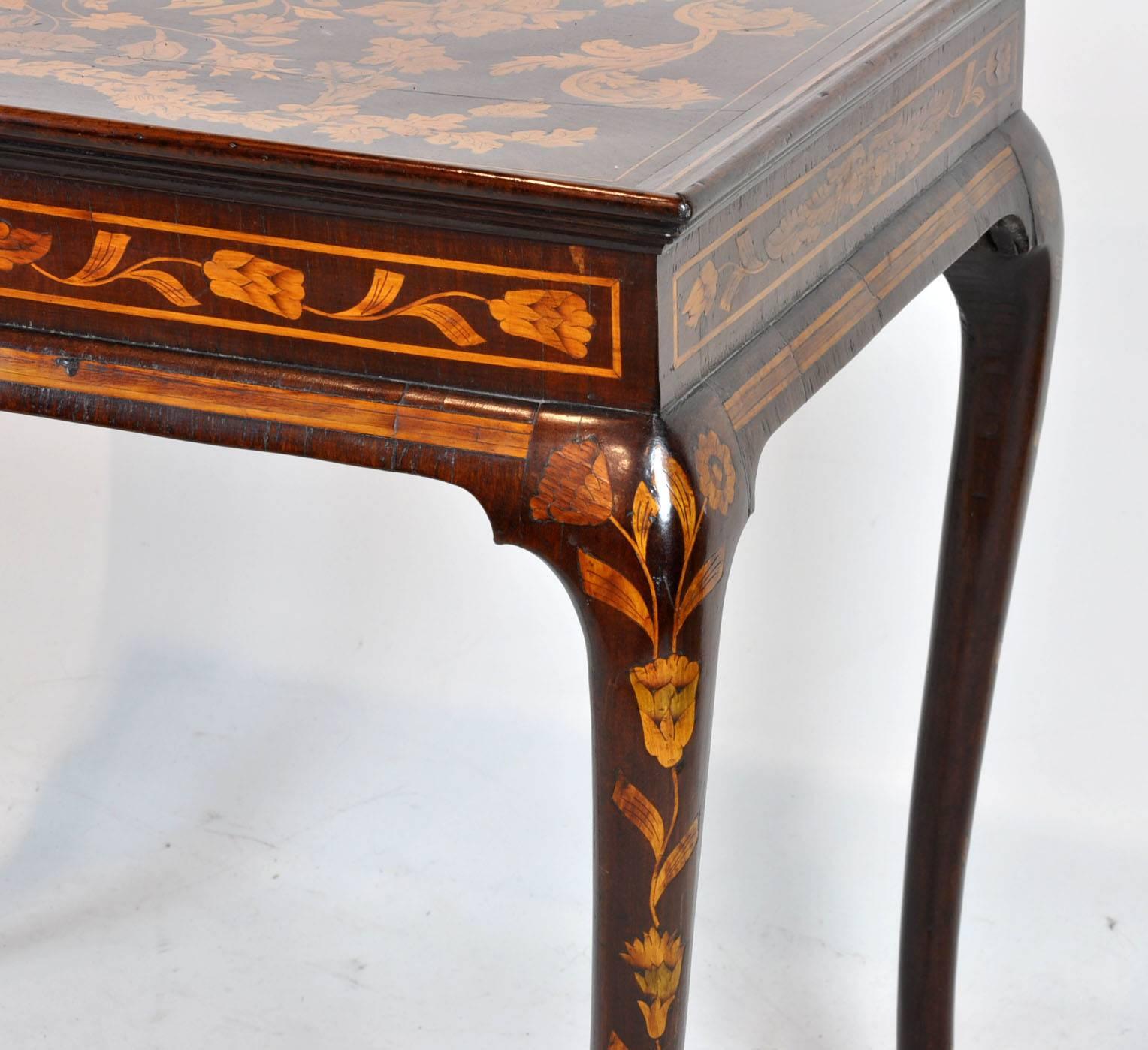 Late 18th century Dutch marquetry queen Anne tea table. Great form and wonderful condition.