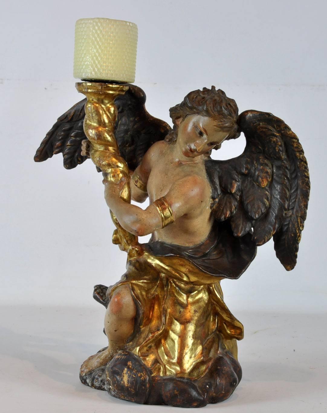 Carved wood winged angels candleholders. Partial paint and gilt.