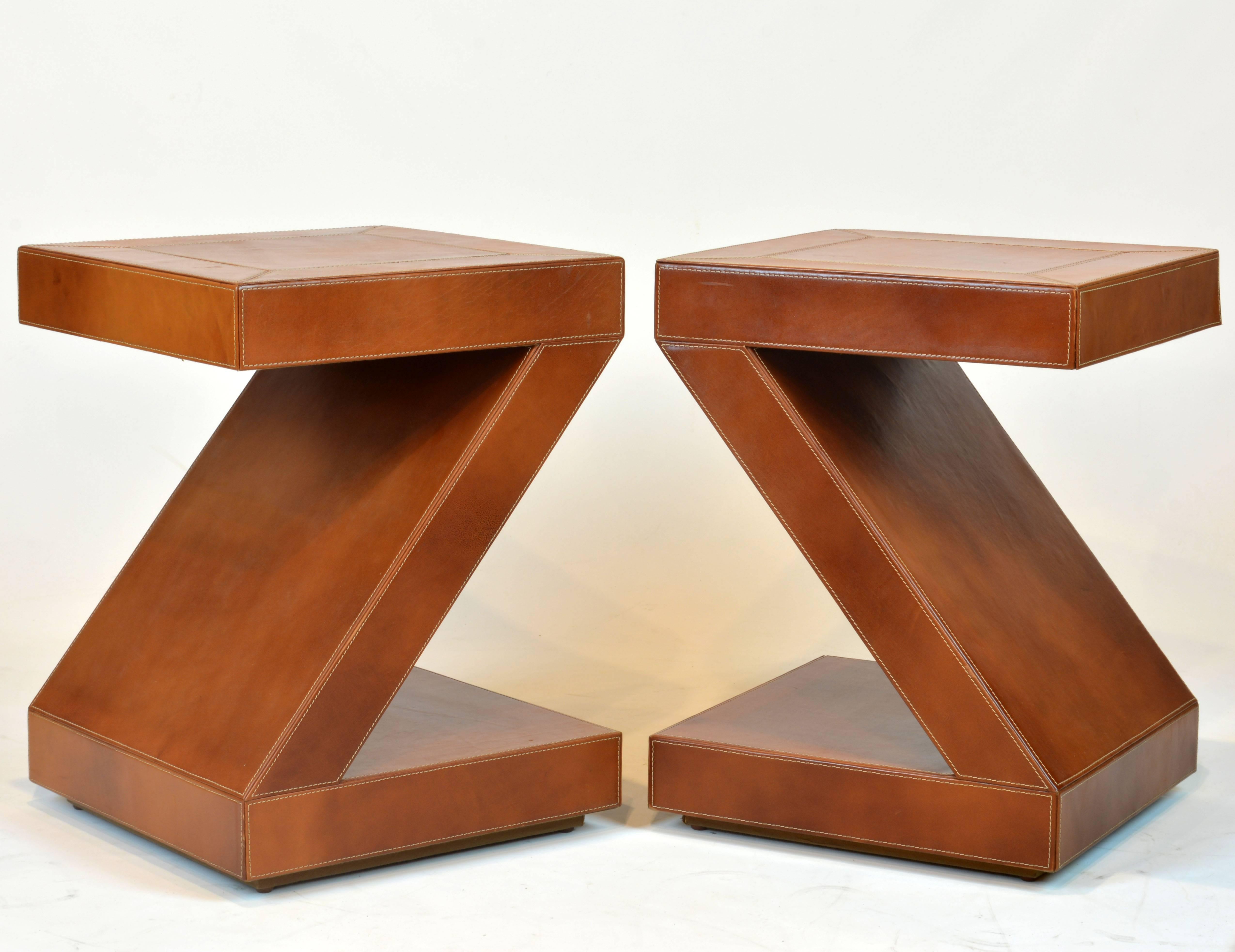 Of impeccable craftsmanship, sturdy construction and Minimalist design these tables gain a subtle feel and color from the first grade and well executed leather covering.