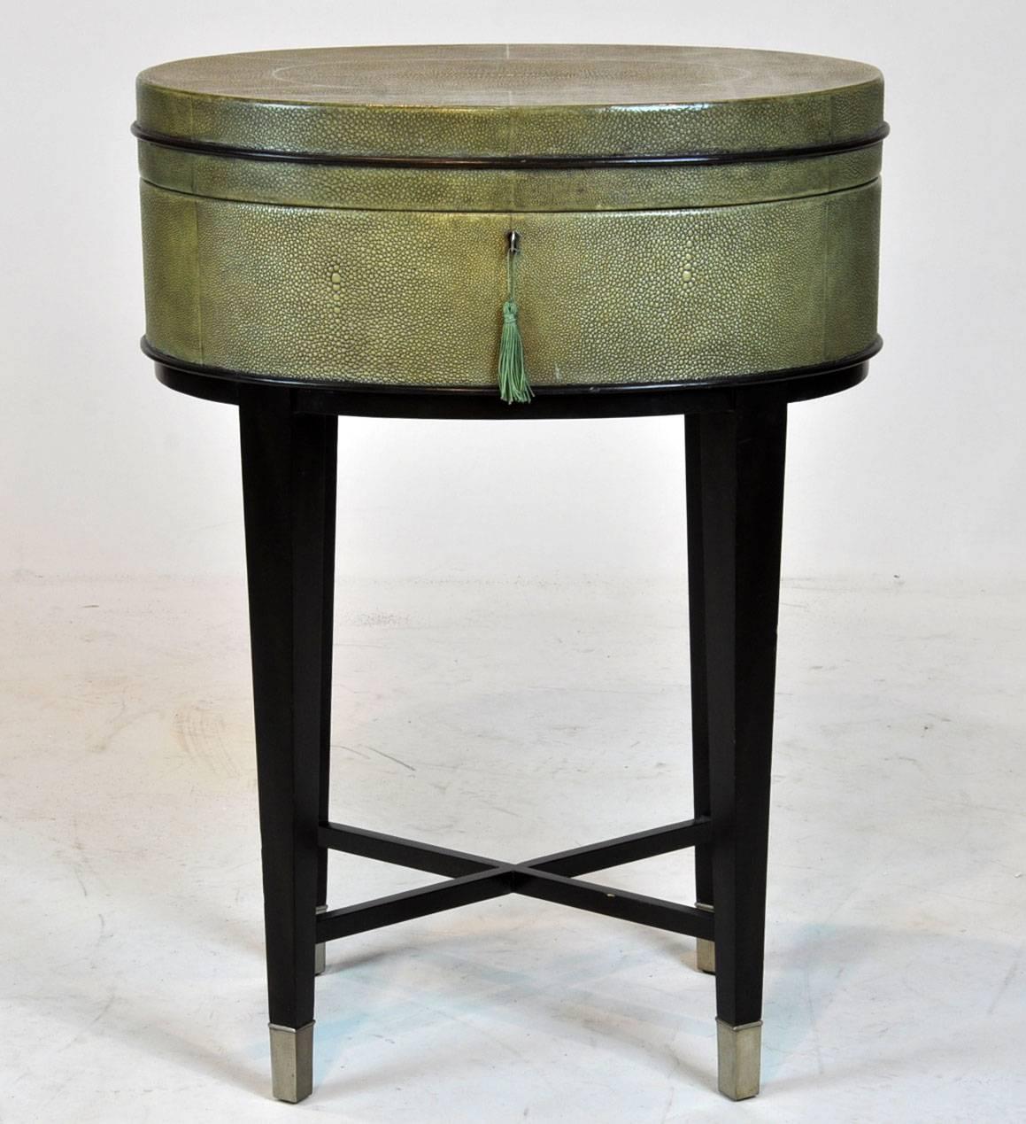 Fabulous pair of Shagreen side tables with lift lid top. Ebonized legs with silver colored casters on bottom. Great condition.