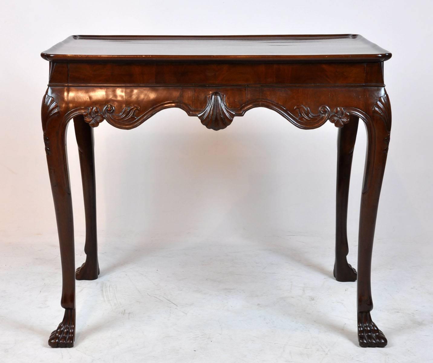 Single board top. English or most likely Irish, late 18th century. Six shell carved Chippendale tea table.