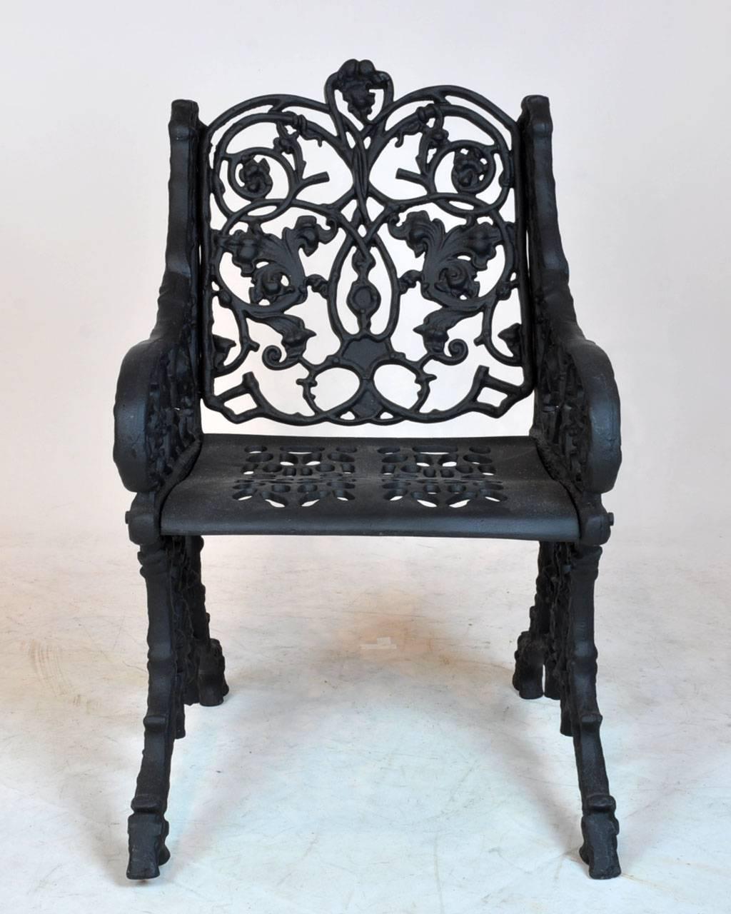 Pair of Victorian iron garden armchairs. Unique root and vine style legs. Recently sand blasted and painted.