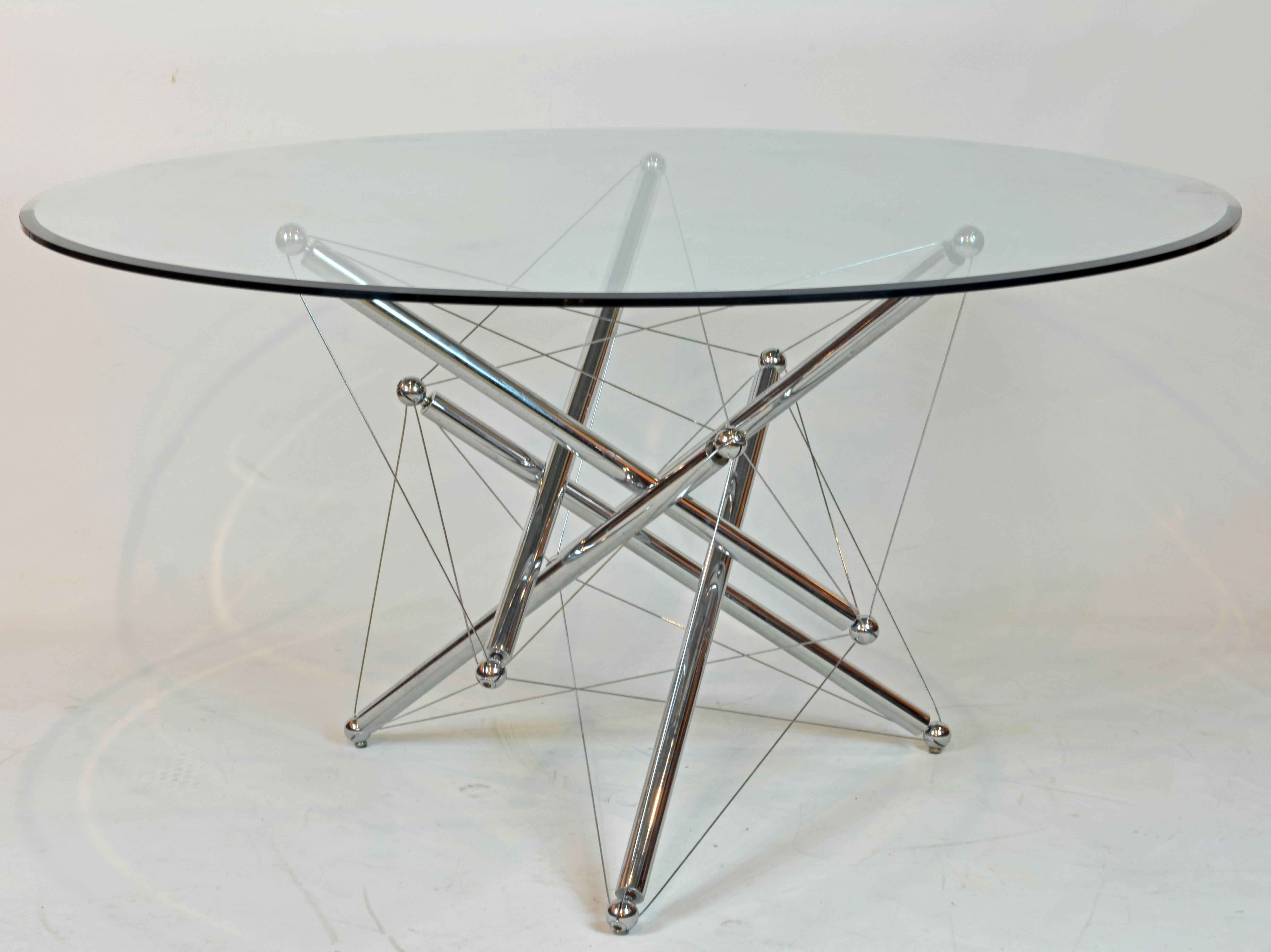 A beveled 0.5 in. crystal glass circular top resting on an intricately constructed base of chromium-plated steel tubes, spheres and cables designed to a configuration of ever changing visual properties. Manufactured by Cassina, Italy in the 1970s
