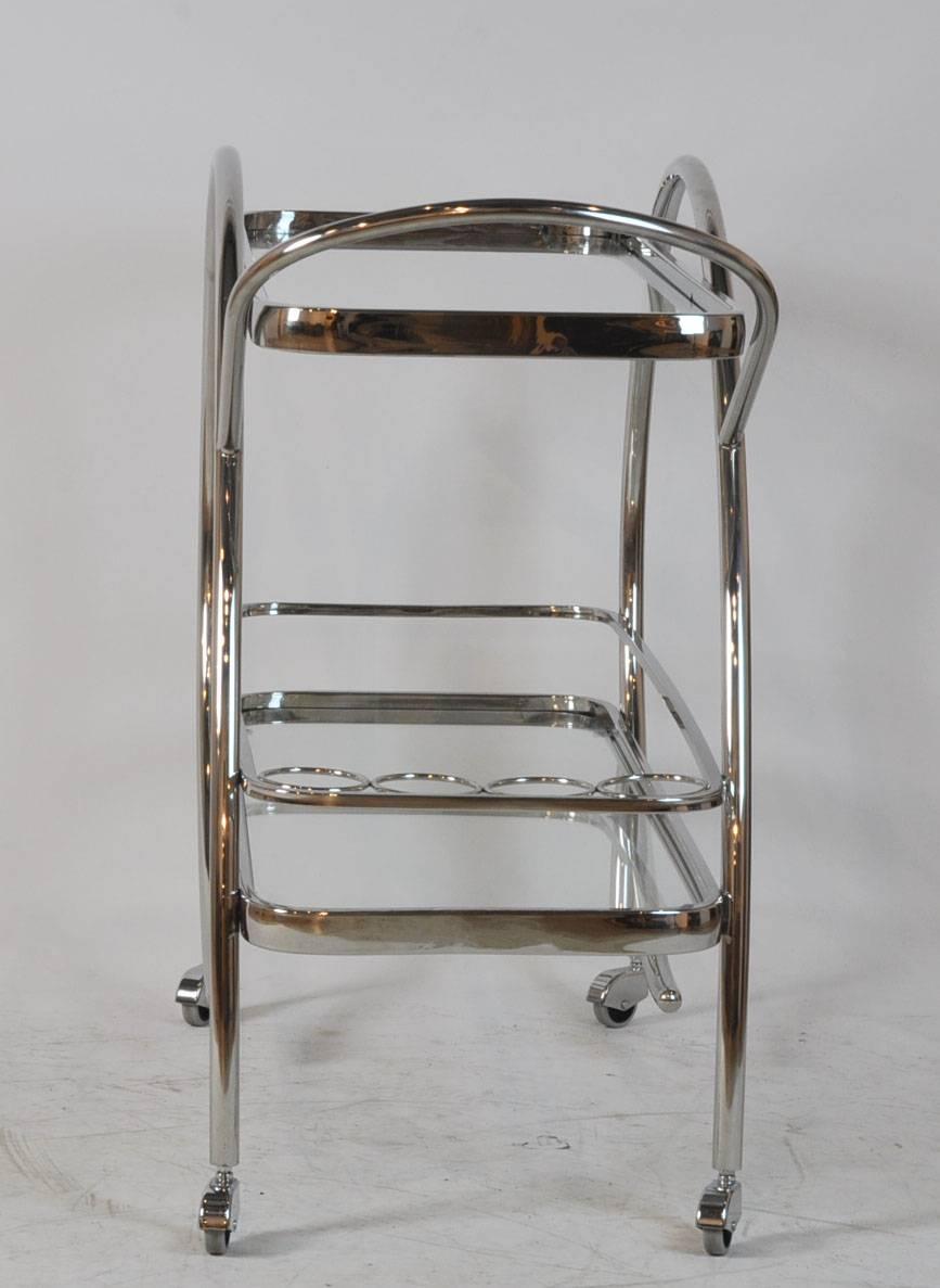 Wonderful chrome bar cart with glass shelves. Unmarked. Very good condition. Chrome in great condition.