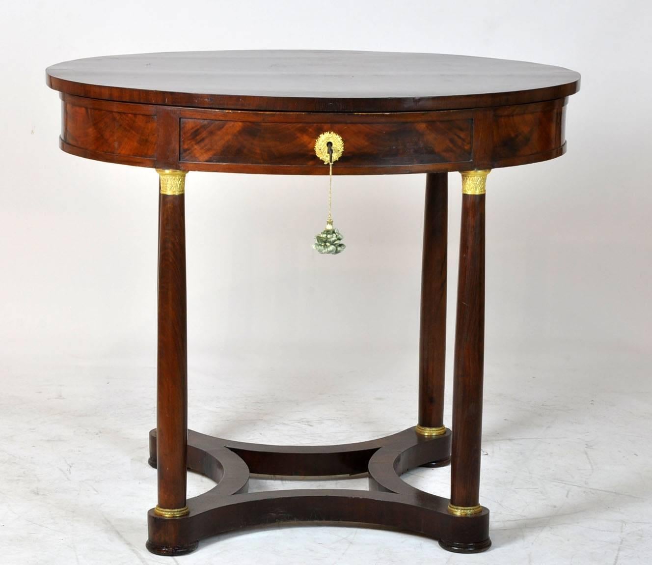 Great Austrian Empire dressing table. Mahogany with brass adornments. Four columns connections to a shaped base. Slip lid top revealing inside compartments. Unusual dressing table, 1840s. Great condition.