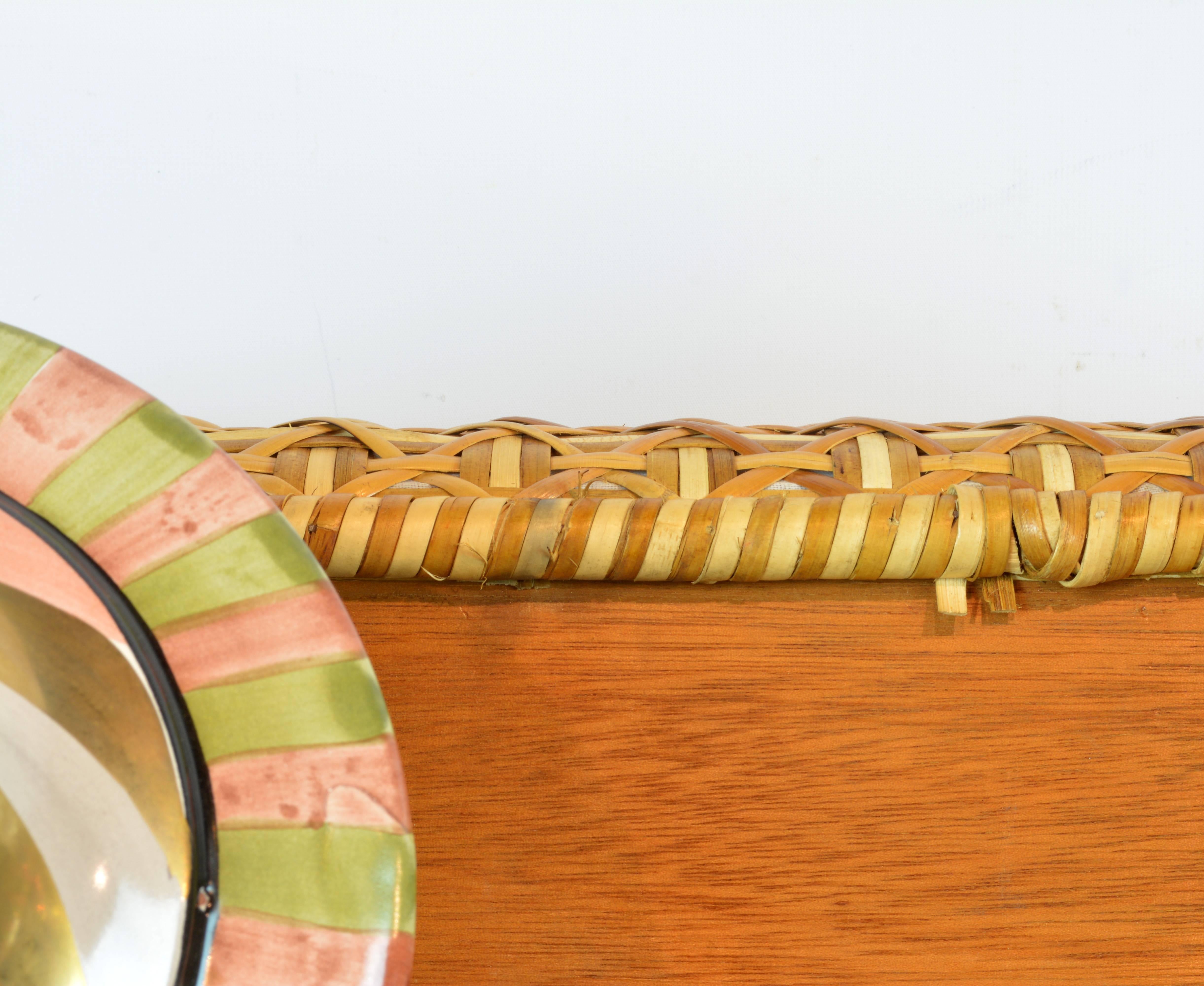 In the eclectic and whimsical style so characteristic for Richard and Victoria Mackenzie Childs this particular ottoman is a feast for the eyes. Resting on four circular ceramic legs glazed in gold and lively colors the seat is covered with an