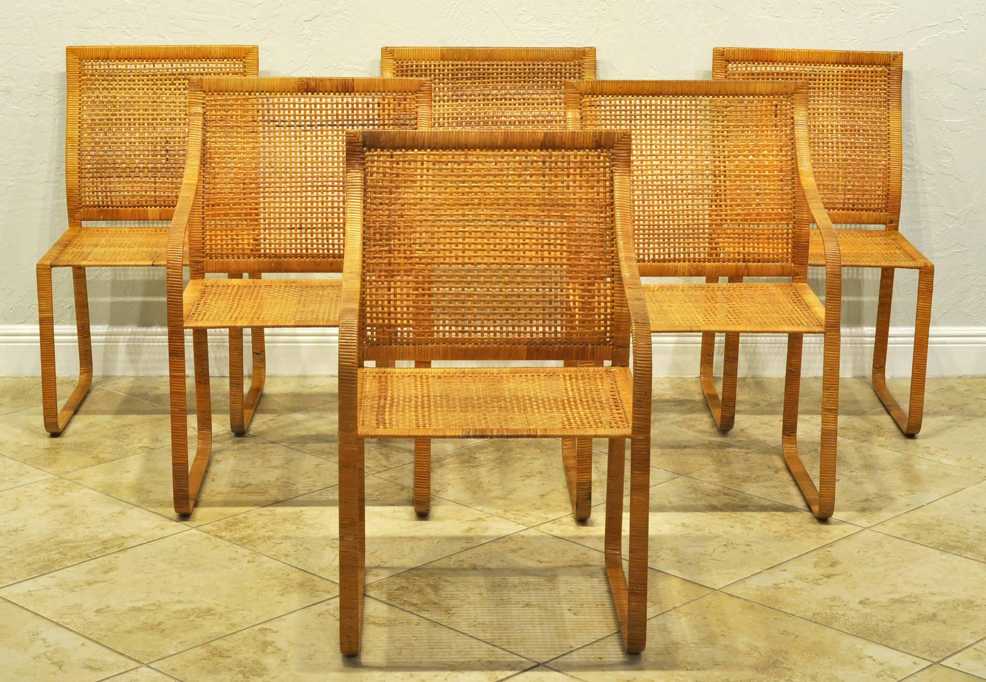 Set of six Harvey Probber Dining Chairs. 4 Arms and 2 Sides. Woven Rattan over steel frames. Overall great condition. Seats and Backs with no breaks. A few loose woven ends on arms or legs. Not marked. Very heavy and sturdy. Comes with upholstered