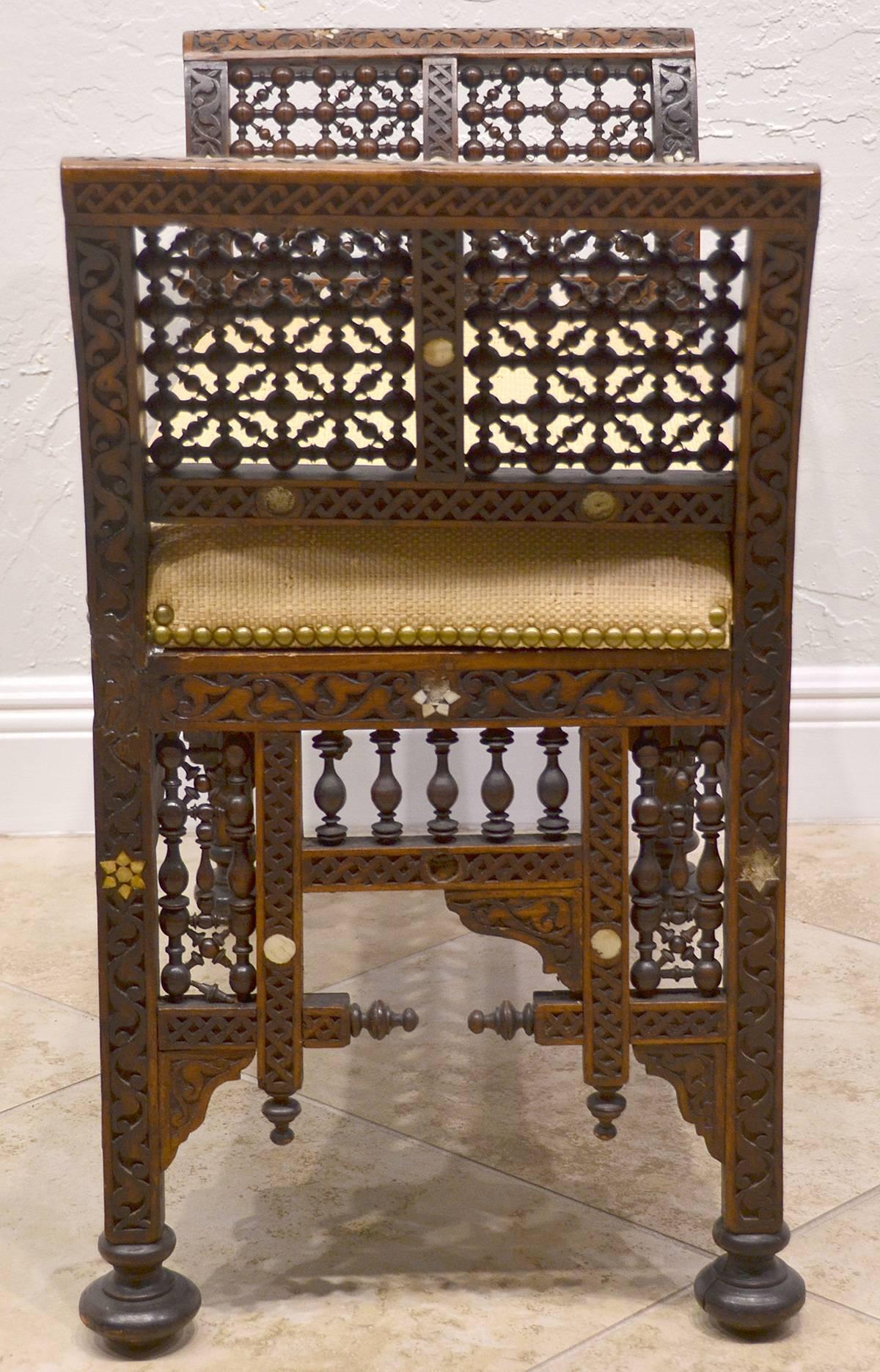19th century Moroccan bench with mother-of-pearl and bone inlay, circa 1880s. Missing a couple bars. See photos.