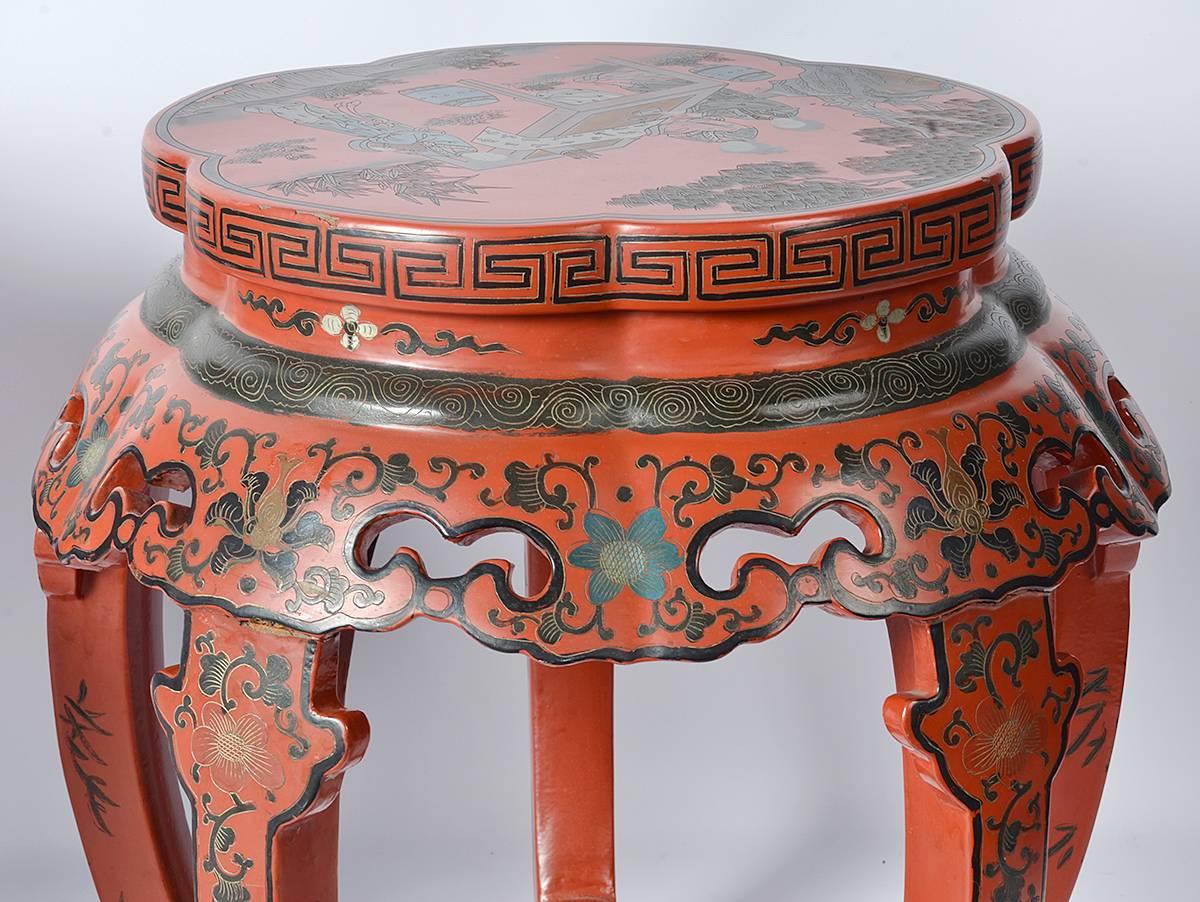 Pair of red lacquered Chinese decorated low tables. Nicely decorated. Very good condition.