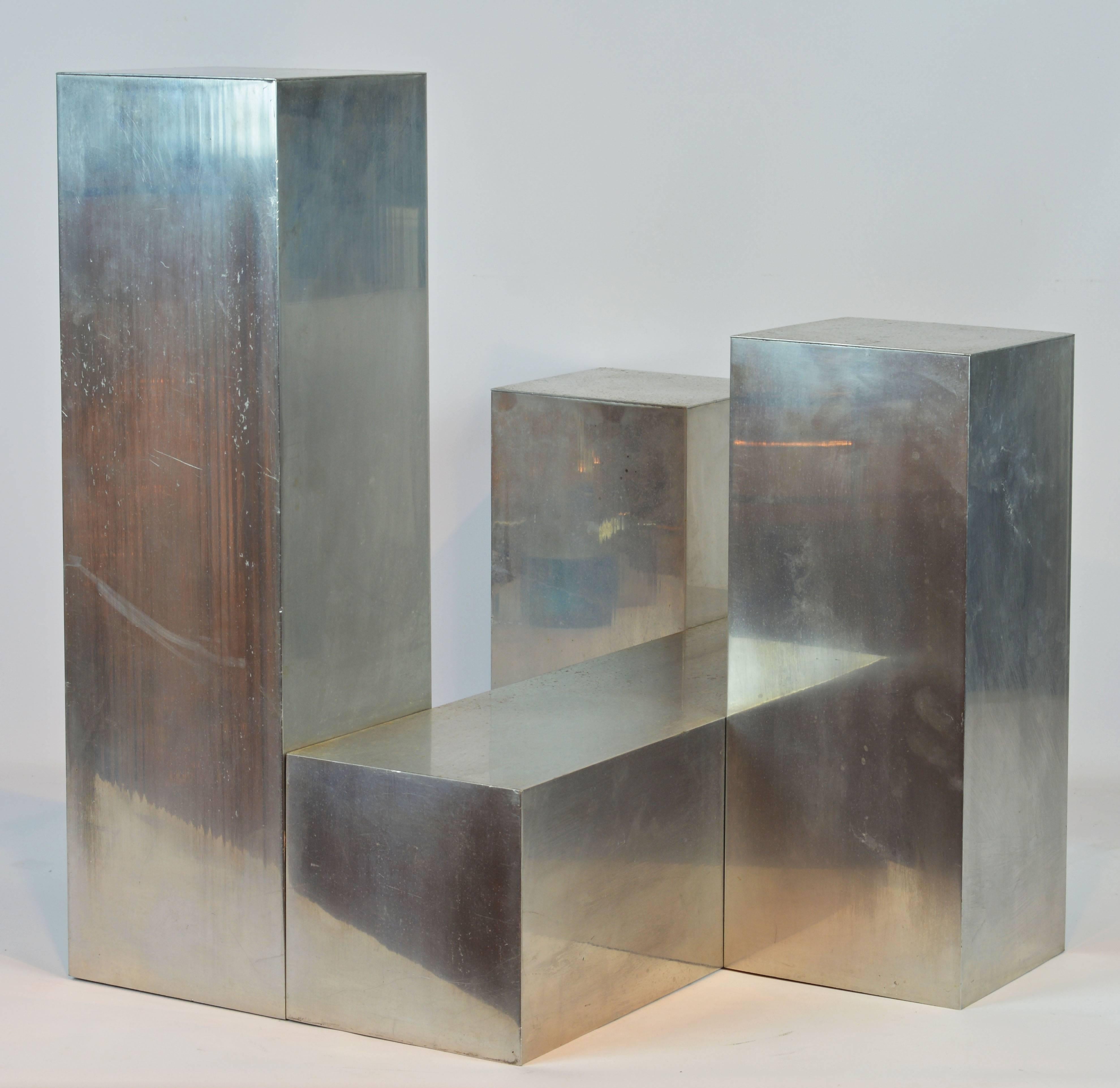 This cubist style sculpture consists of four elements combined in an intriguingly simple composition offering great views from whatever angle. The sculpture can be displayed as shown, but it also offers great surfaces for the display of artifacts.