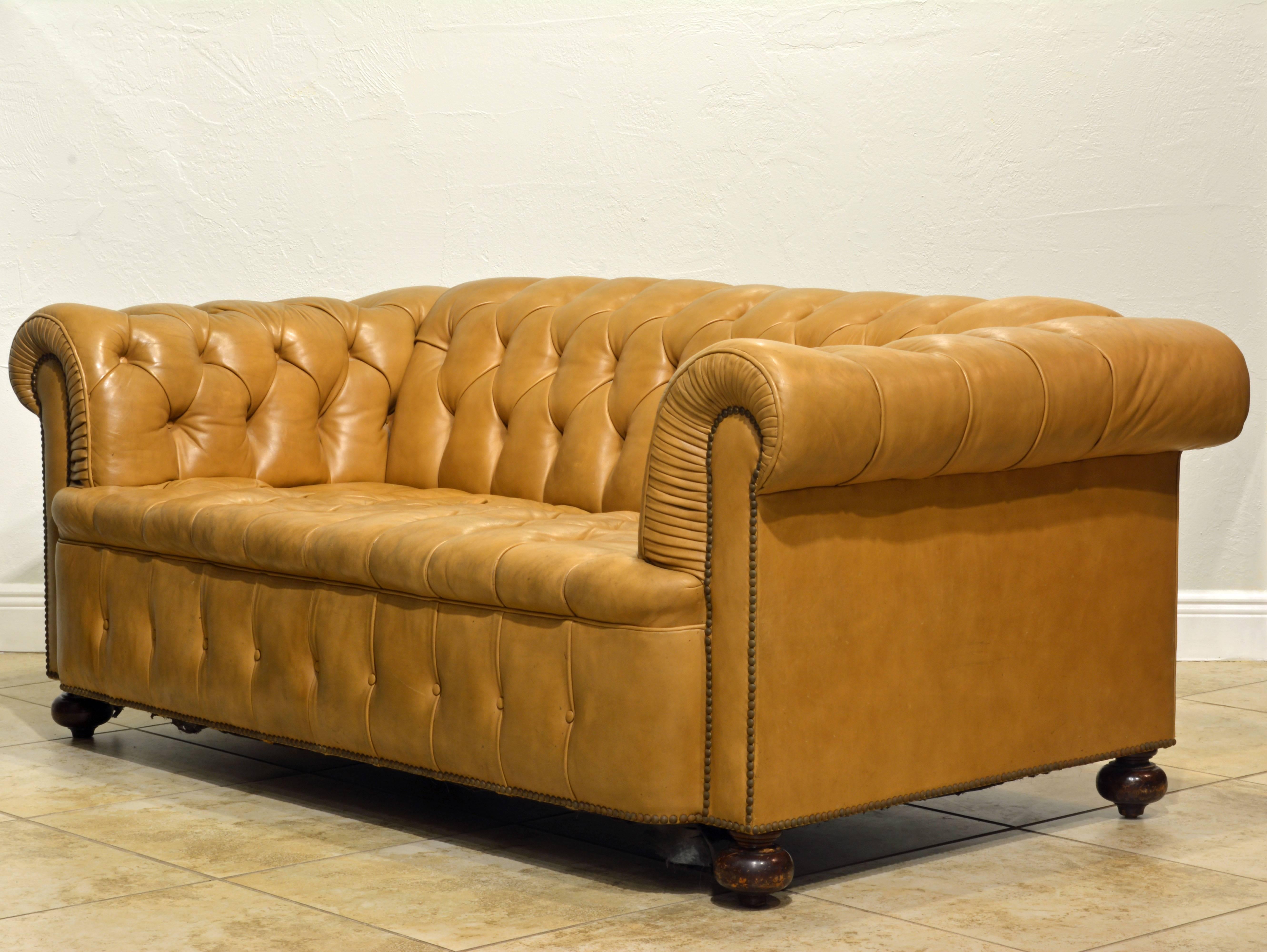 English Pair of Vintage Leather Chesterfield Sofas with Rolled Arms and Nailhead Trim