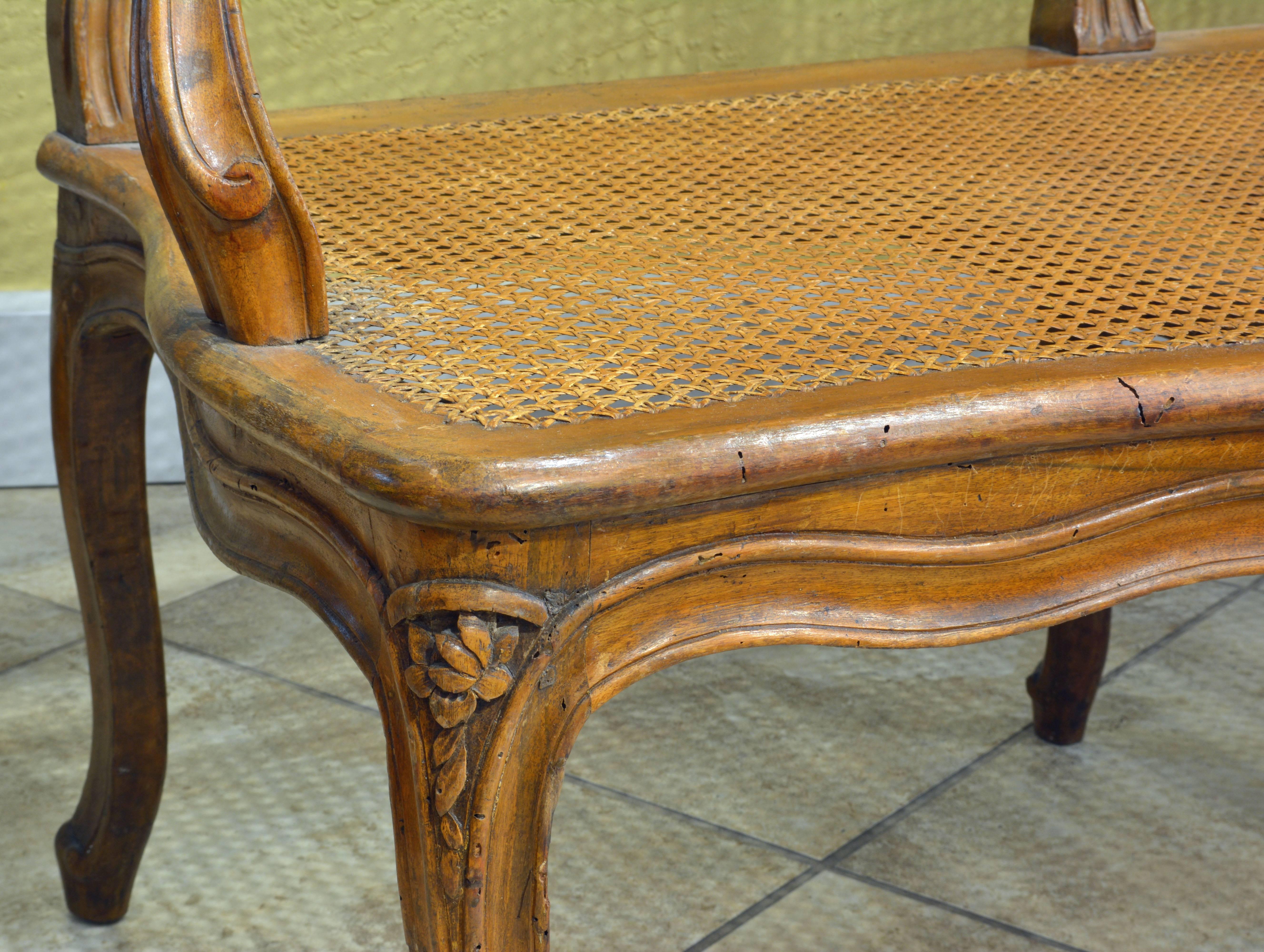 French Provincial Late 18th Century Provincial Louis XV Style Carved and Caned Walnut Settee