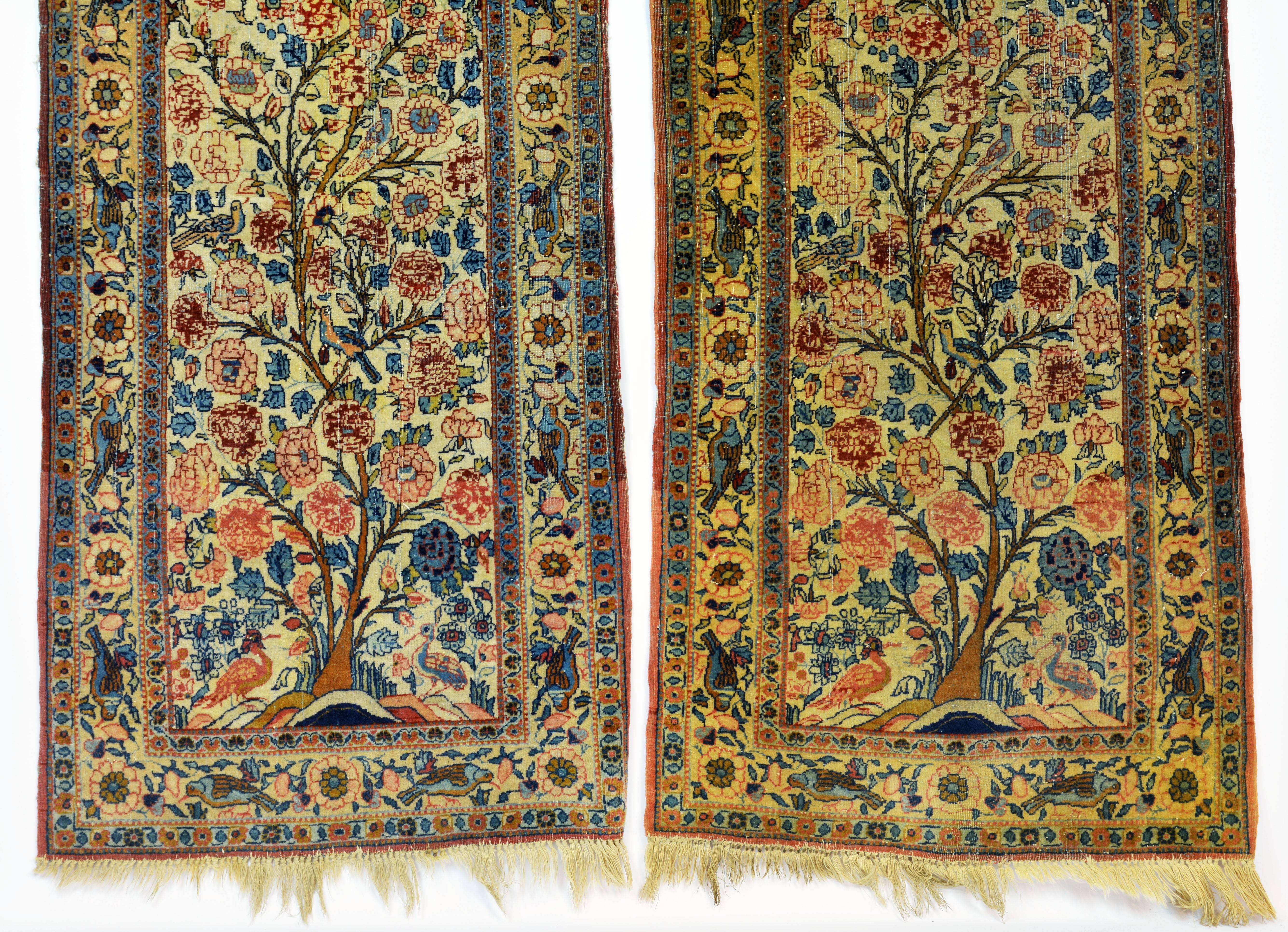 Not often do we find a pair of rugs. These Persian Lavar Kerman prayer rugs of the early or mid-20th century feature densely woven 'tree of Life' motif with flowers and birds in beautiful subdued blue, red and rose colors. The borders feature birds