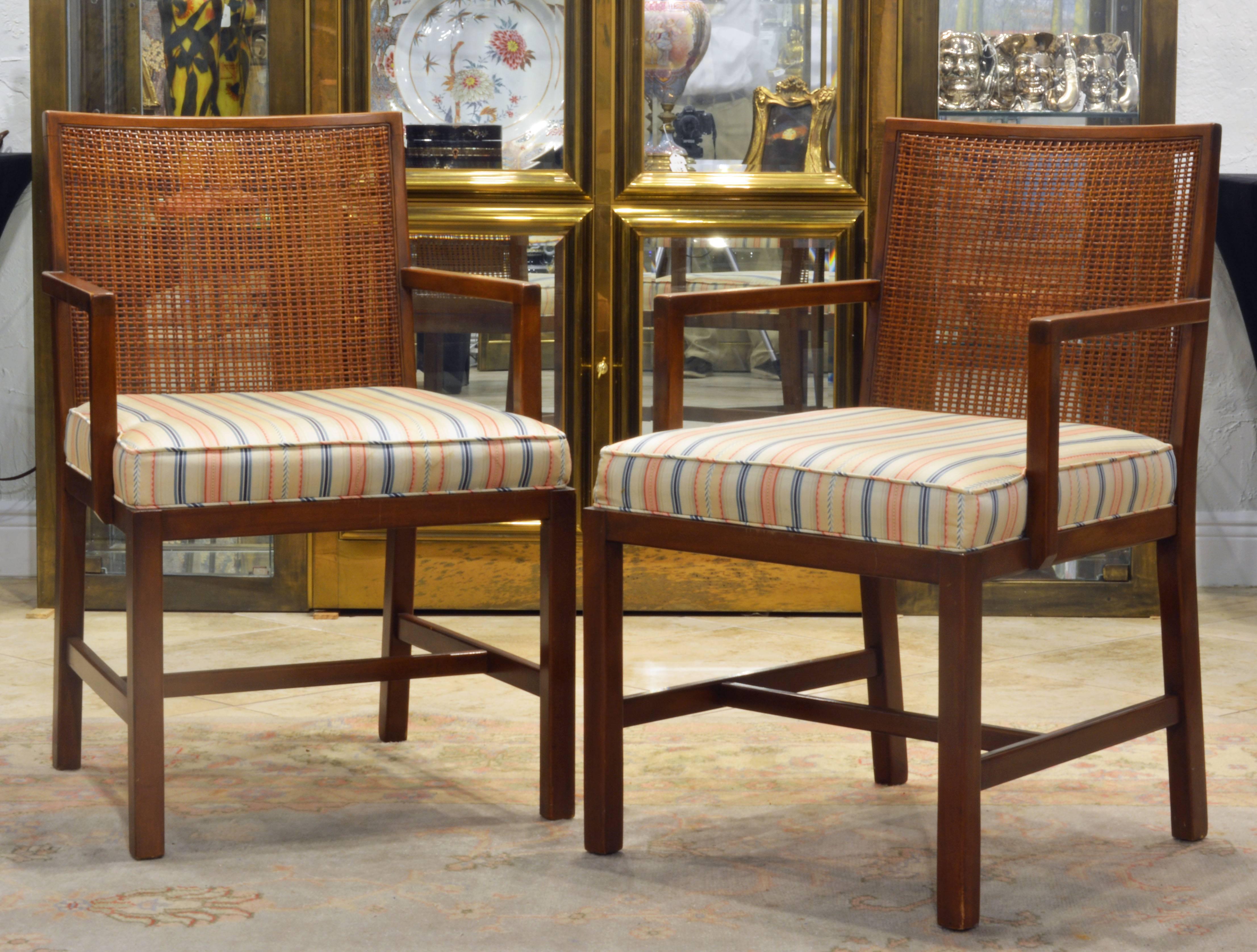 These Mid-Century Modern chairs feature elegant design and classic modern form that will always be synonymous with good taste. The combination of a sturdy but minimalist frames, cane backs and upholstered seats is very comfortable. The measurements