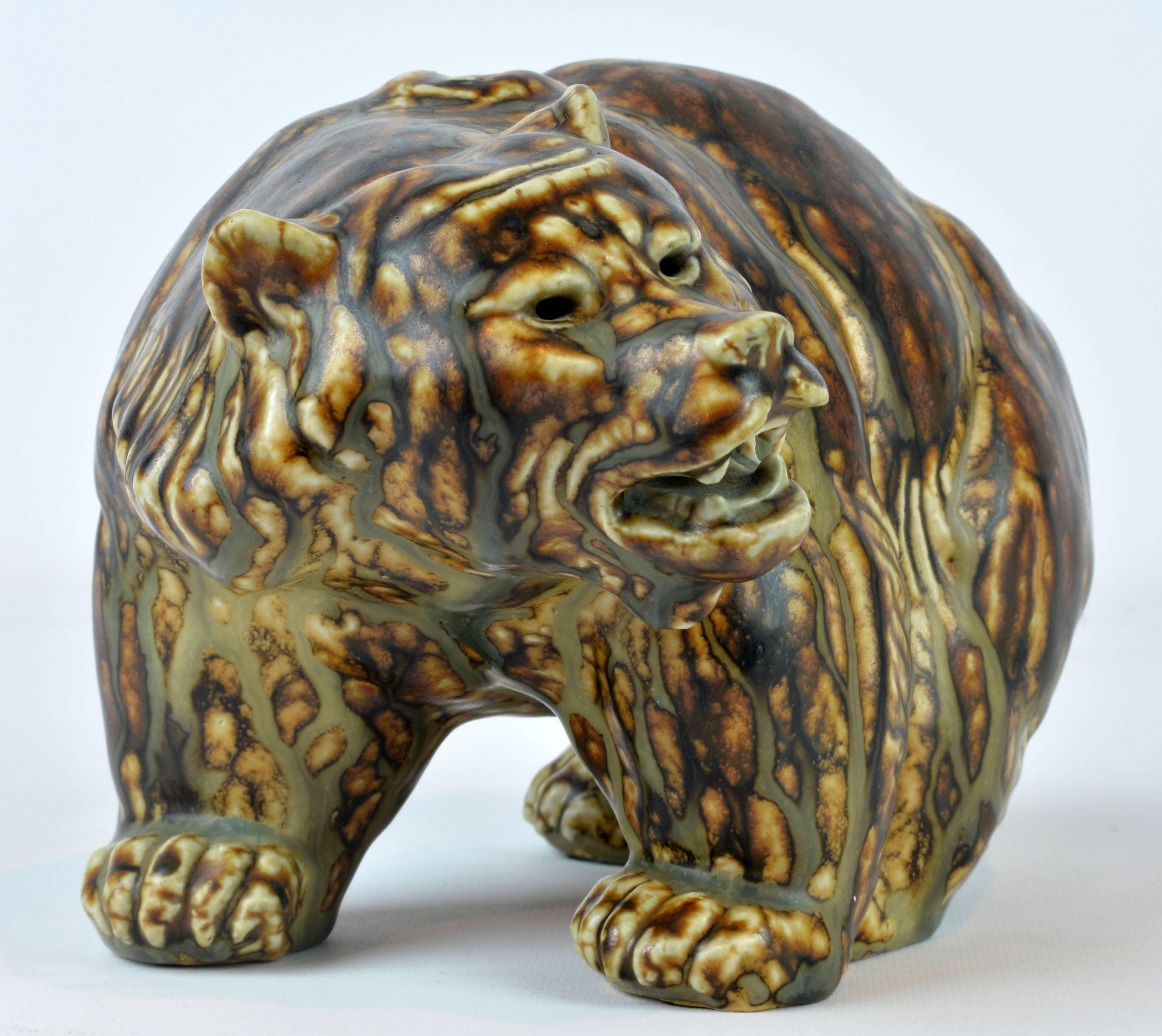 A beautiful and impressive sung glazed stoneware sculpture by Knud Kyhn for Royal Copenhagen. Factory 1st. Royal Copenhagen marks and incised artist's signature under paws, see photos. L 9 in. D 6.75 in. H 5.75 in. Flawless condition.