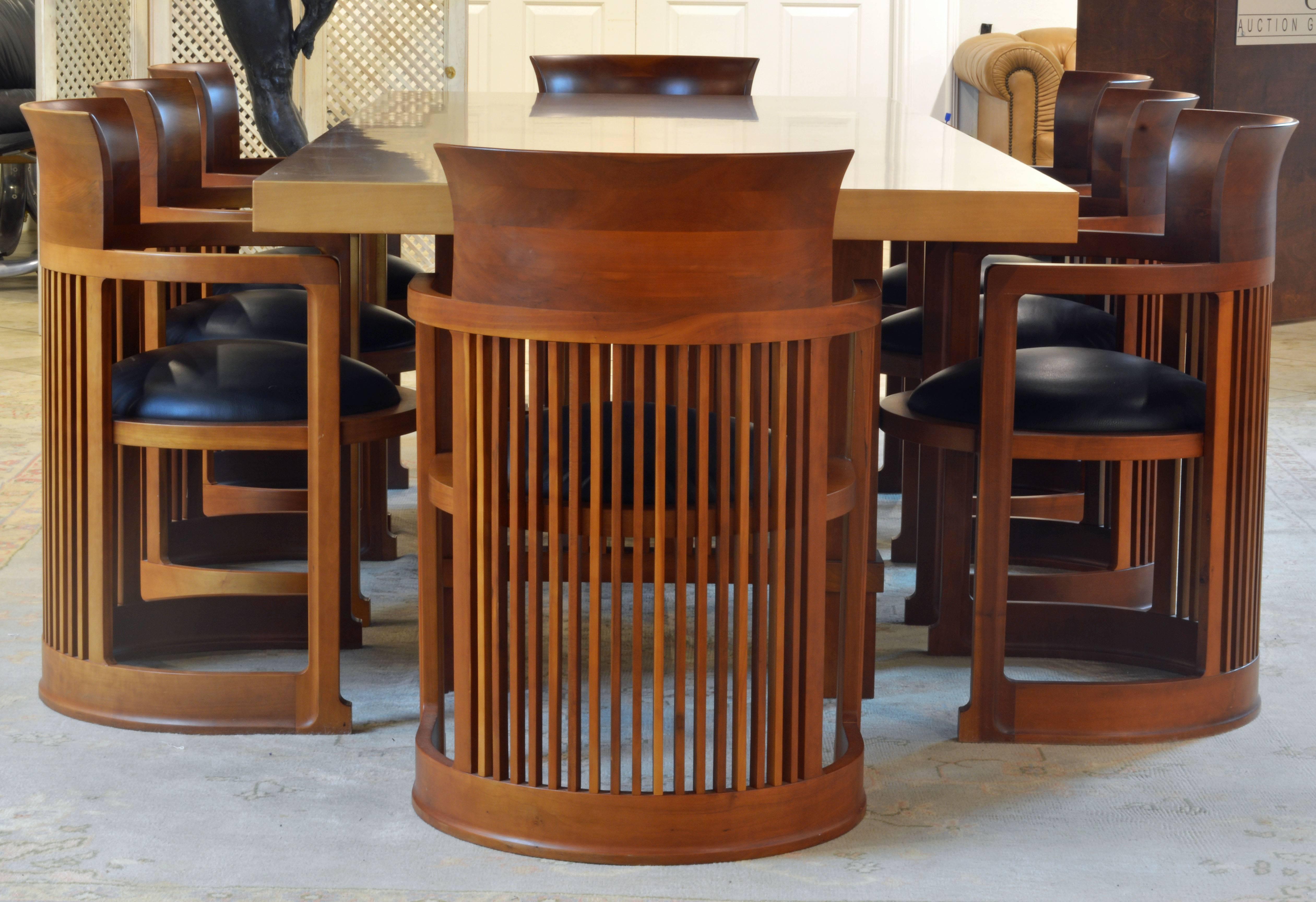 This group of Frank Lloyd Wright Taliesin inspired dining table and chairs are made in Italy and features high quality of craftsmanship and materials. Measurements: The table is 98.5 inches long, 38.5 inches wide and 29 inches high. The chairs are
