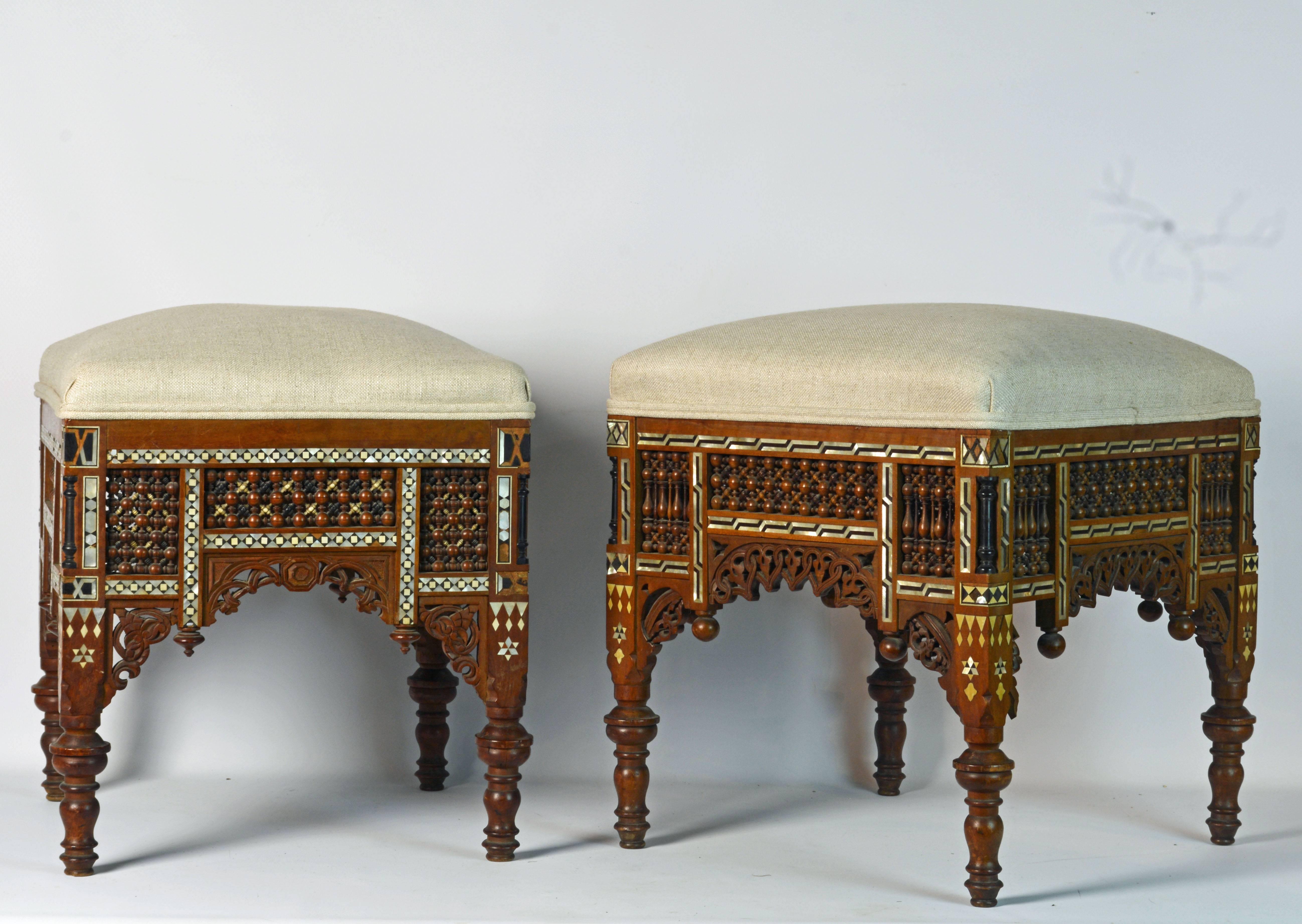 Of the same size and proportions these stools or ottomans feature slightly different ornamentation actually adding to their attractiveness. The design is typical for Islamic tradition where architectural elements are often used in furniture. The