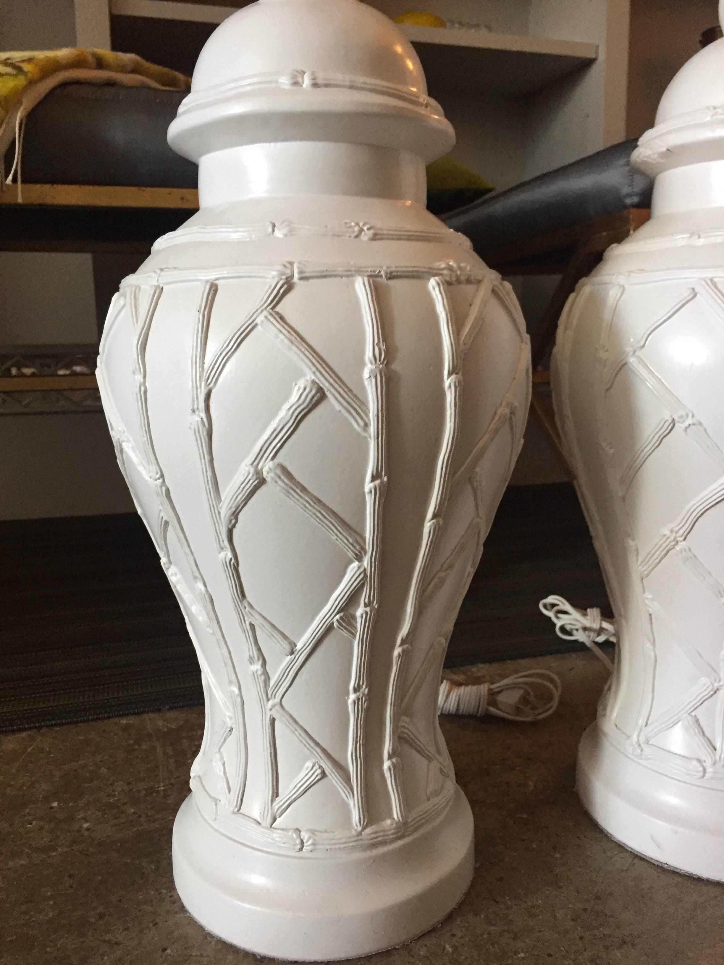 Vintage 20th century white faux ceramic bamboo ginger jar table lamps. Pairs with many colors and shapes of shades to add sophistication and glamour to living or bedrooms.