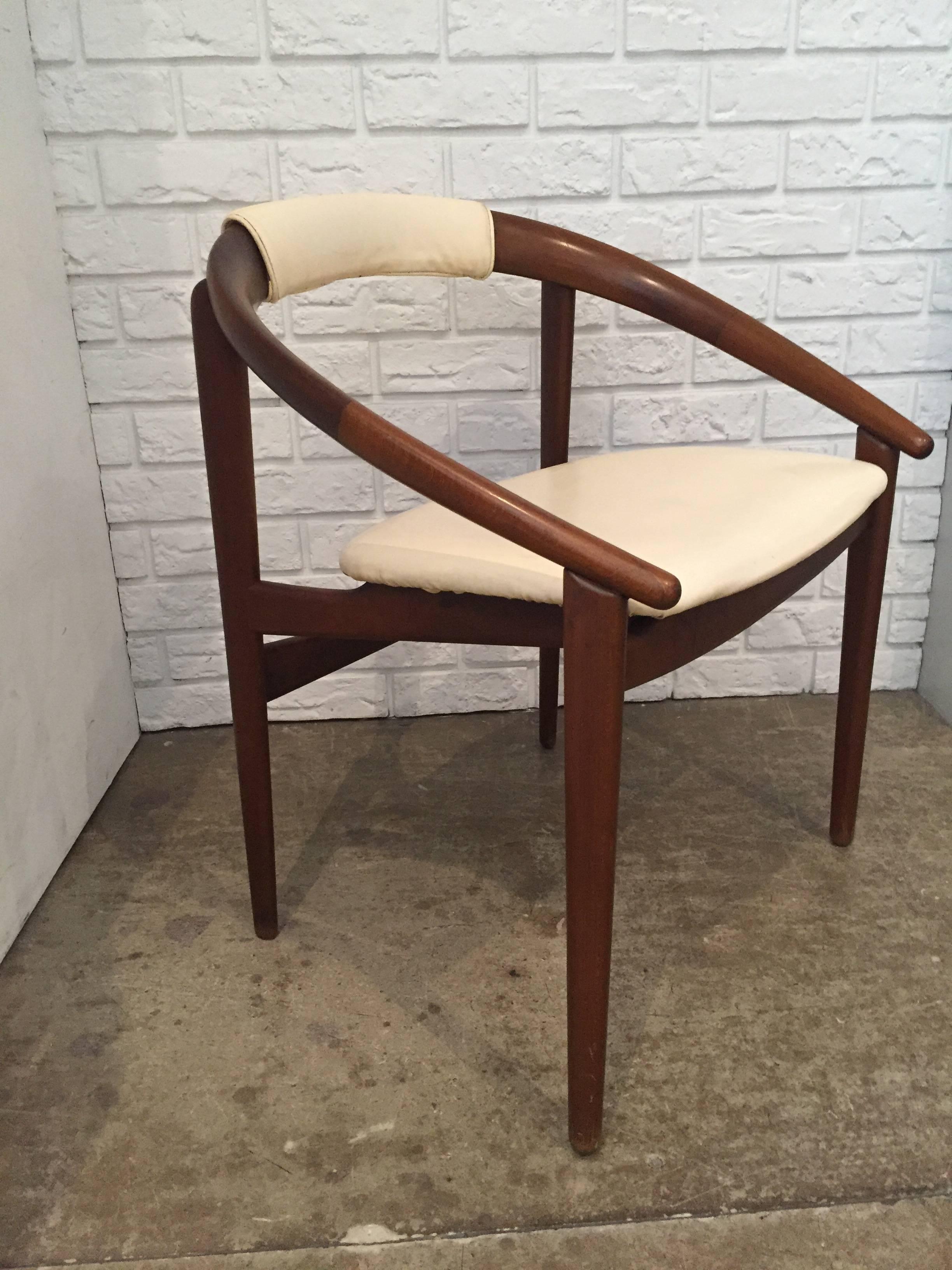 Pair of Mid-Century chairs. Rounded open back walnut frame with white leather seat and back.