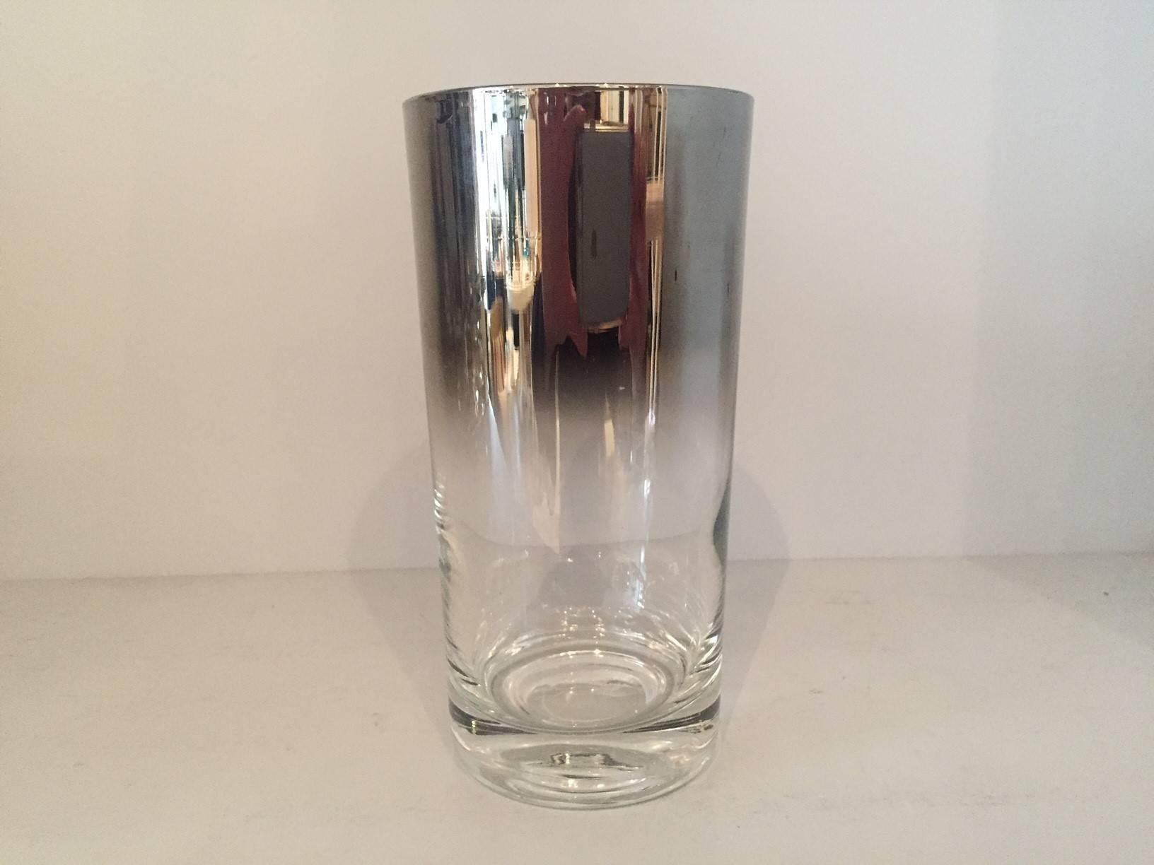 Dorothy Thorpe Set of eight highball glasses. Clear glass with signature mercury ombre detailing at top.  Chrome ice bucket and carrier. 

Dorothy Thorpe glassware was a chic staple of every Mid-Century Modern wet bar, particularly her festive Rolly