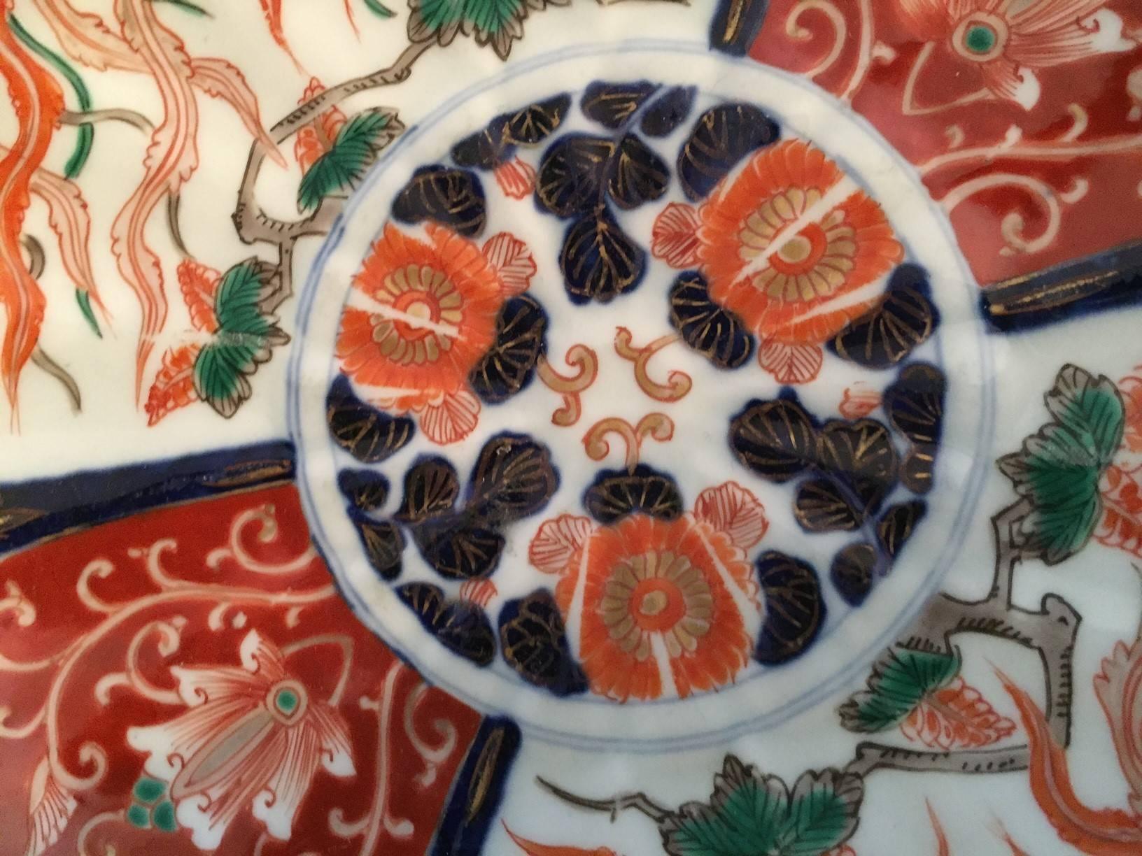 Imari 19th century Japanese dish with scalloped edge detail. Navy, orange, gold and white porcelain.