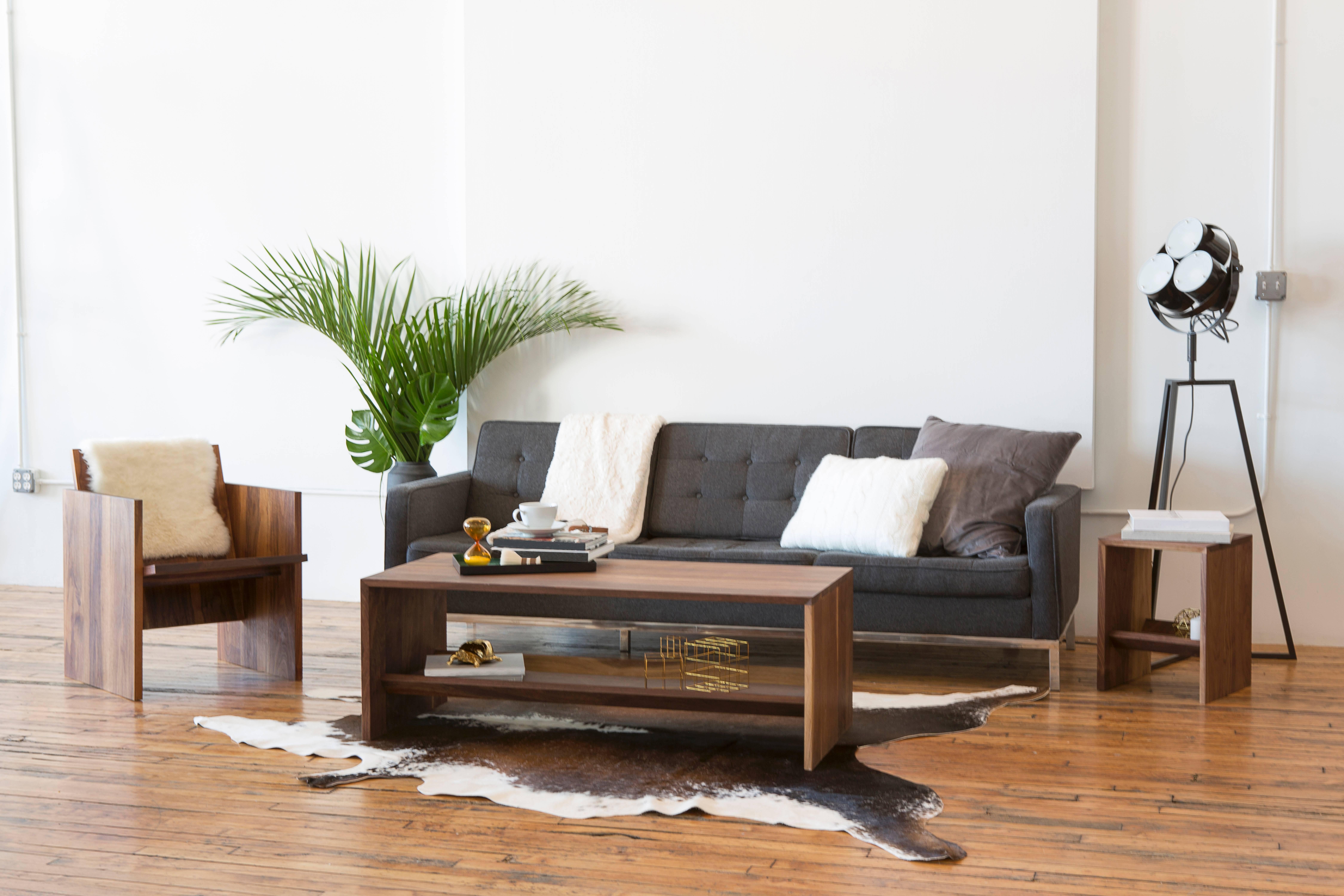This sturdy coffee table is made entirely out of solid walnut slabs and precision joinery.  Rugged yet refined, the coffee table's durable and liquid/impact resistant hardwood surface can walk away unscathed from even your most brutal living room