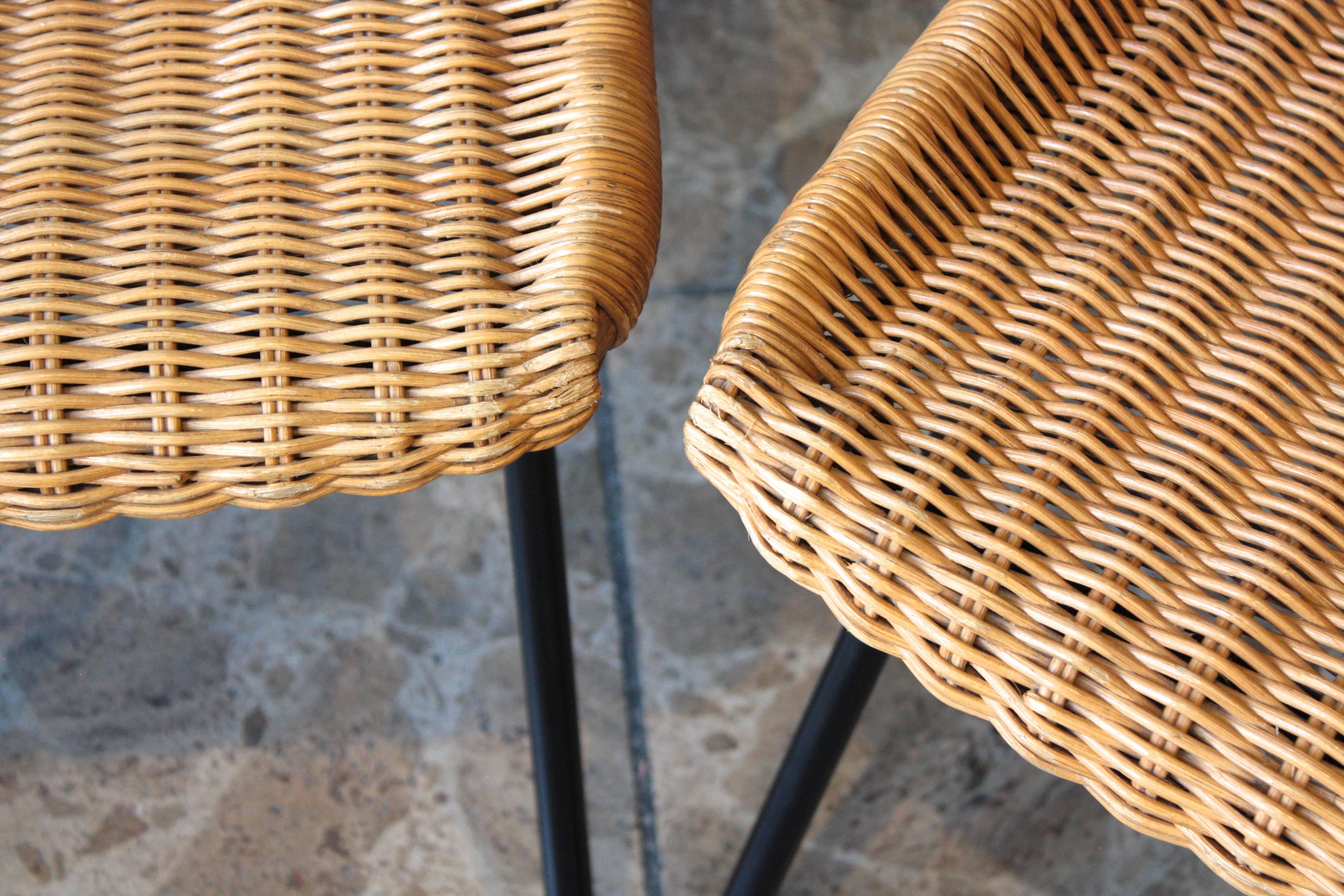This set of two rattan chairs was designed by Dirk van Sliedregt and produced by Rohé Noordwolde in the Netherlands.
