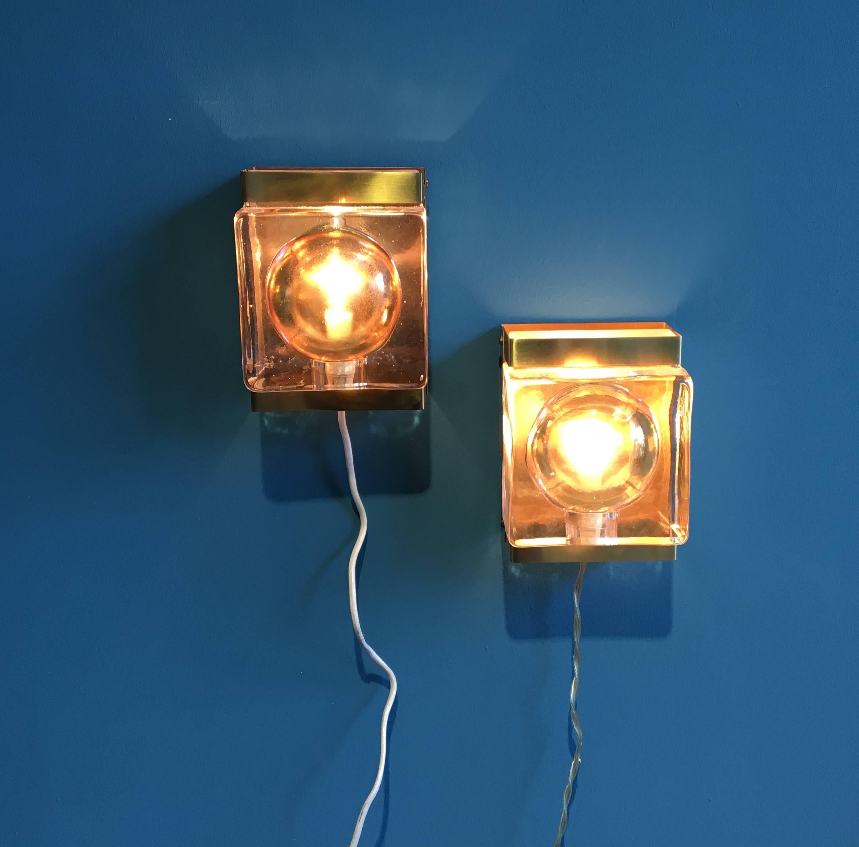 This set of two wall lamps was produced by the Danish company Vitrika in the 1970s and is made of brass and thick and heavy glass. The fixture designed for single candelabra style socket with sphere bulb. European wiring.