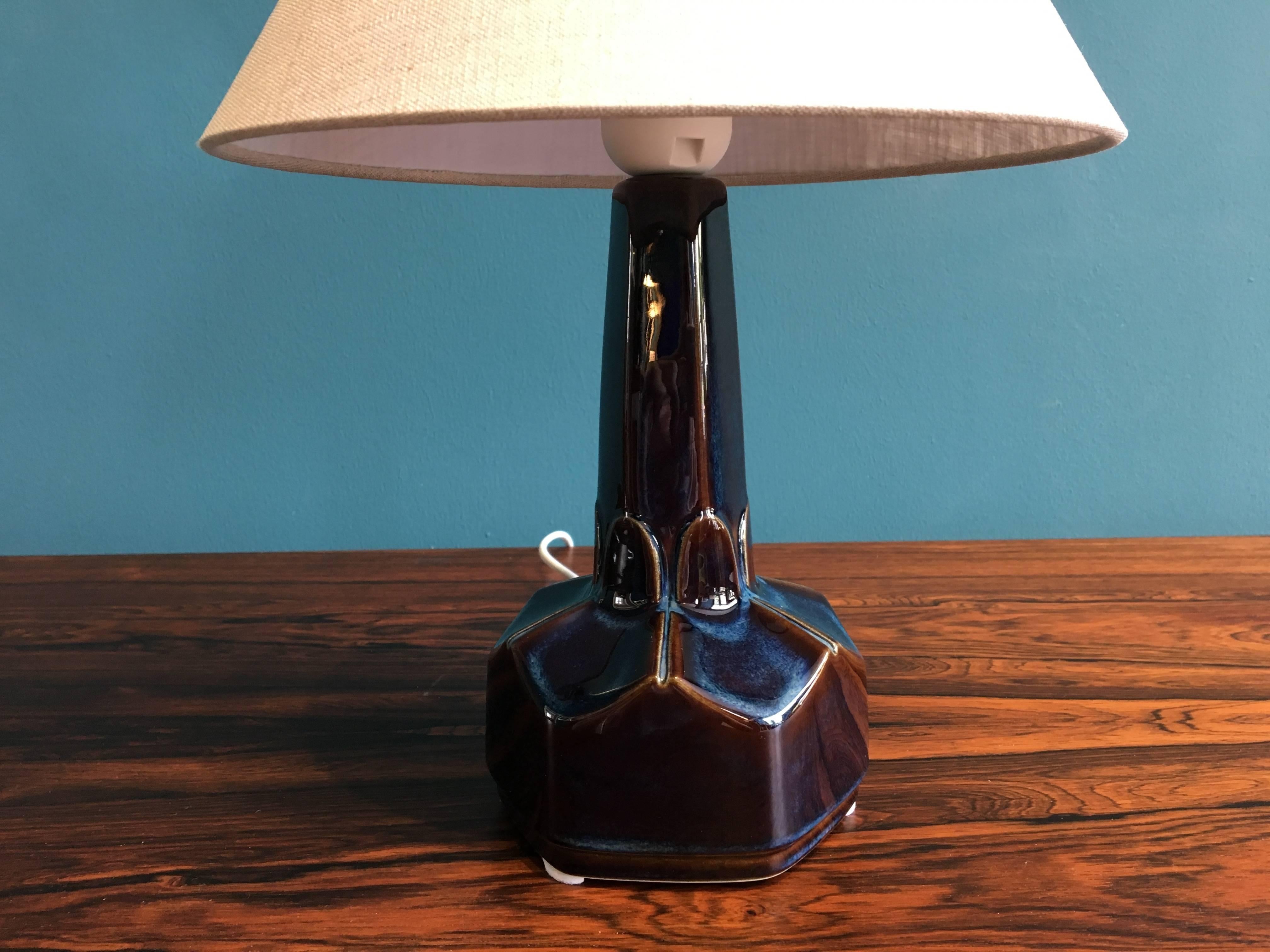 This small ceramic table lamp was designed by Einar Johansen and produced by Soholm Stentoj in Denmark in the 1960s. The lamp has been rewired with switch and has a new socket and shade. New European wiring and plug. Søholm was founded in 1835, in