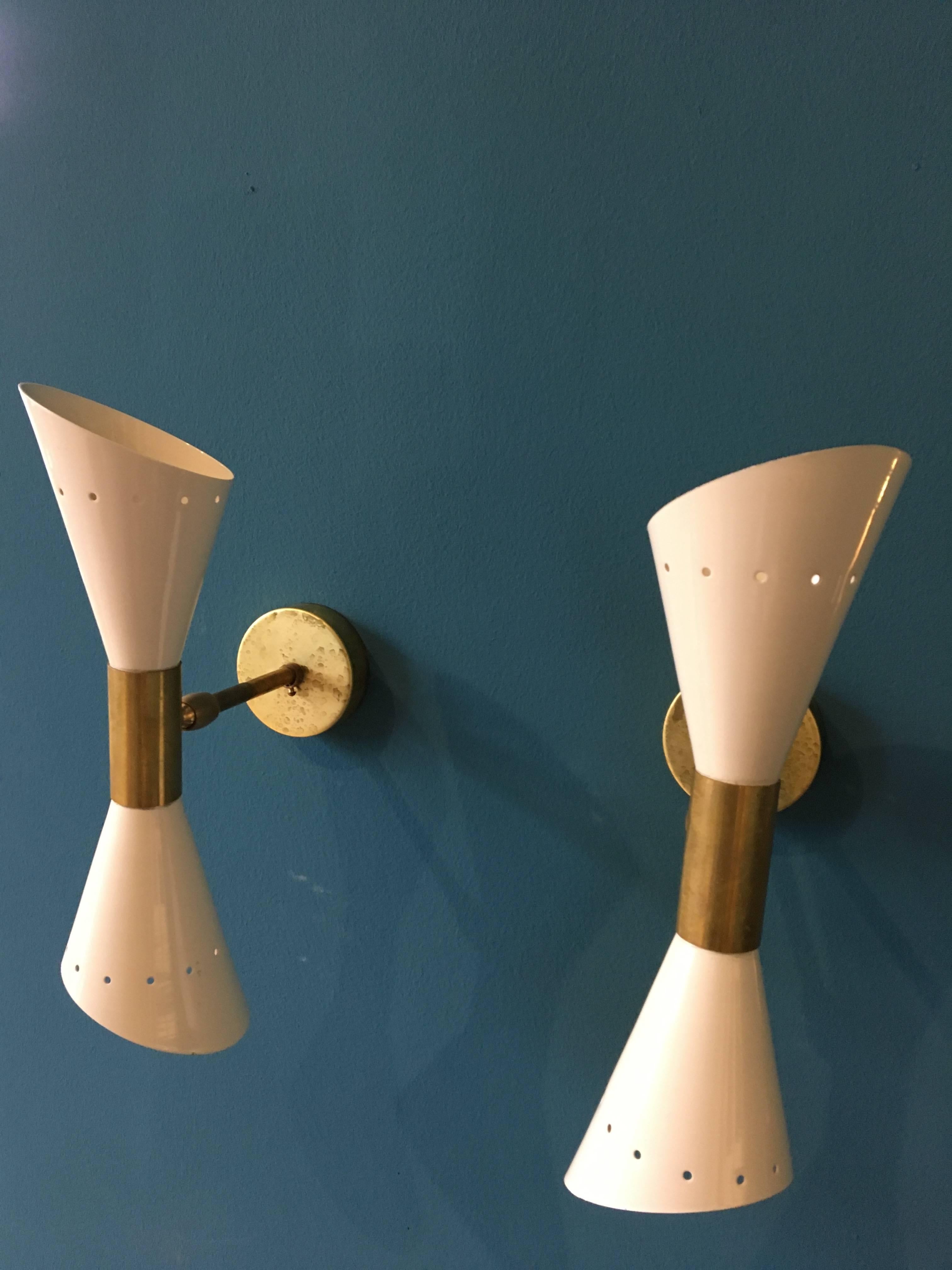 - Pair of Italian sconces with brass elements
- Fully adjustable and rotatable
- Each light uses two E14 bulbs 
- This allows it to light in both directions, up and down
- It is possible to use only one bulb at a time
- No dents, rewired, and ready