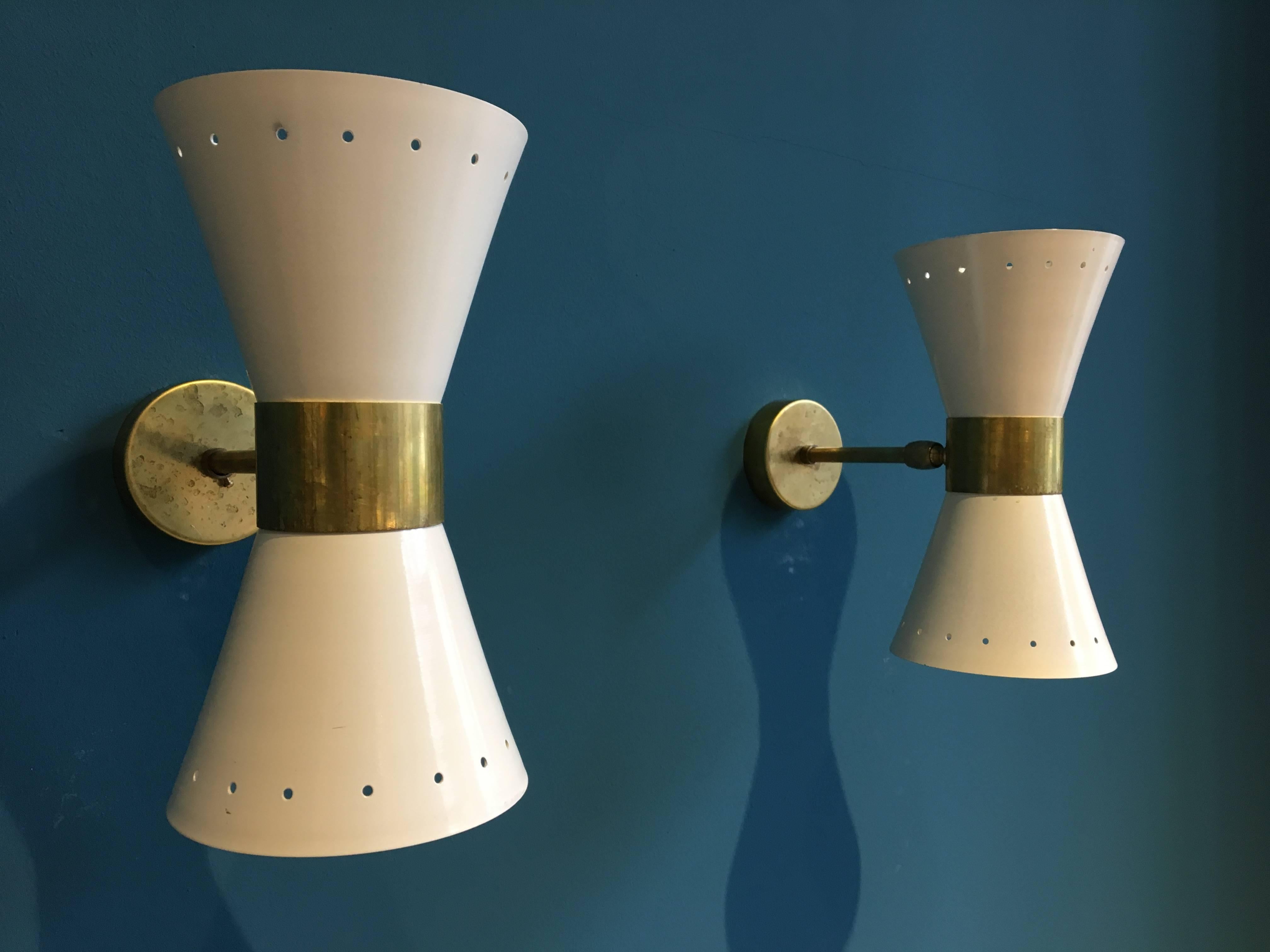 - Pair of Italian sconces with brass elements
- Fully adjustable and rotatable
- Each light uses two E14 bulbs
- This allows it to light in both directions, up and down
- It is possible to use only one bulb at a time
- No dents, rewired, and ready