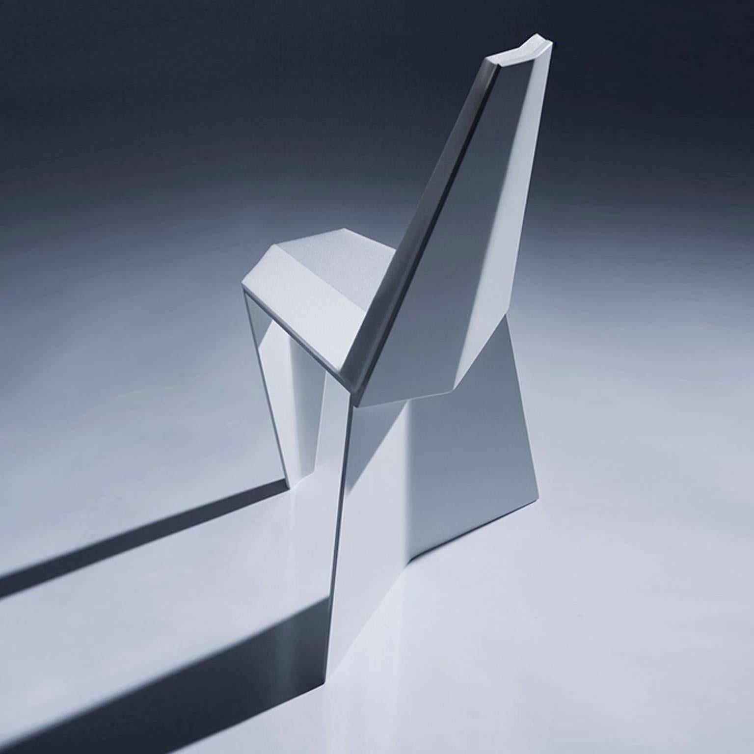 The facets of the Crystallized Chair catch and reflect the changing daylight like a crystal. The intent of this indoor/outdoor recycled metal dining chair is to resemble origami, which suits the manufacturing process of bent metal. NEA Studio worked