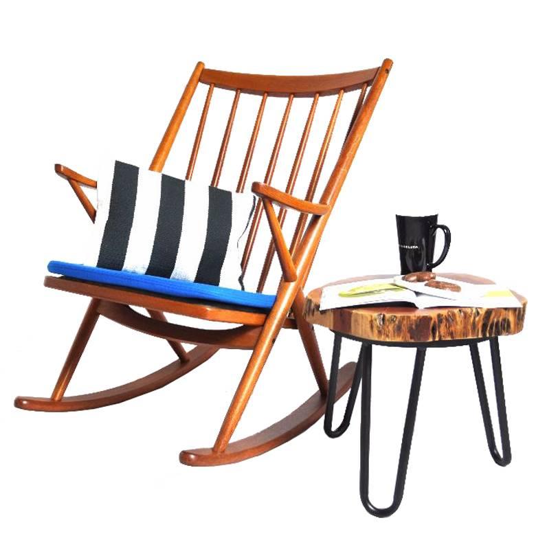 This rocking chair was designed by Frank Reenskaug in 1958 and produced by Bramin Møbler. The frame is made from teak and the cushion is covered in black and white Kilim fabric.