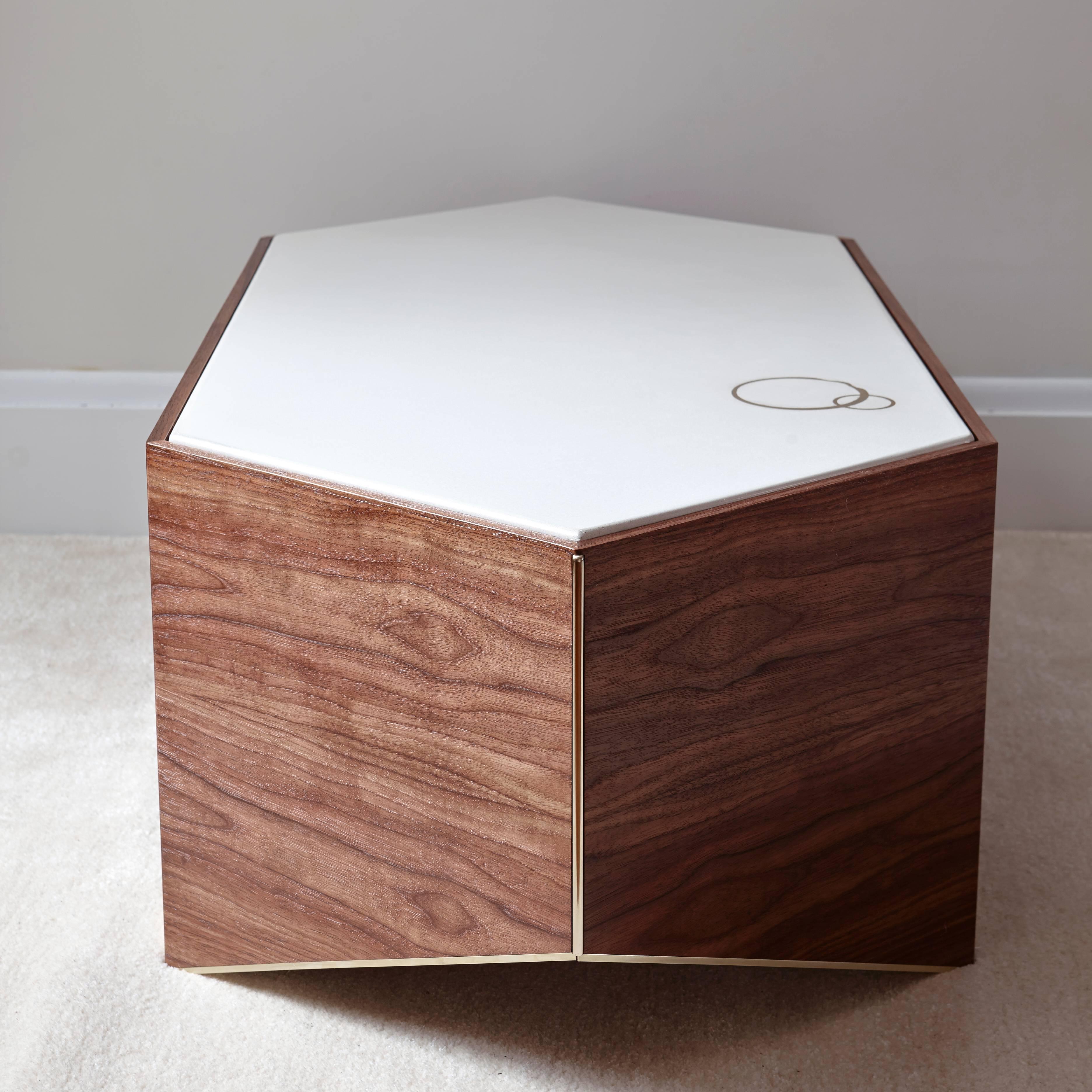 Cocktail table base is made from two sheets of bent walnut plywood, tastefully edged in brass. Tabletop is cast white concrete with inlaid brass rings, suggesting good times past and to come.

This table is customizable.

Made in Brooklyn.