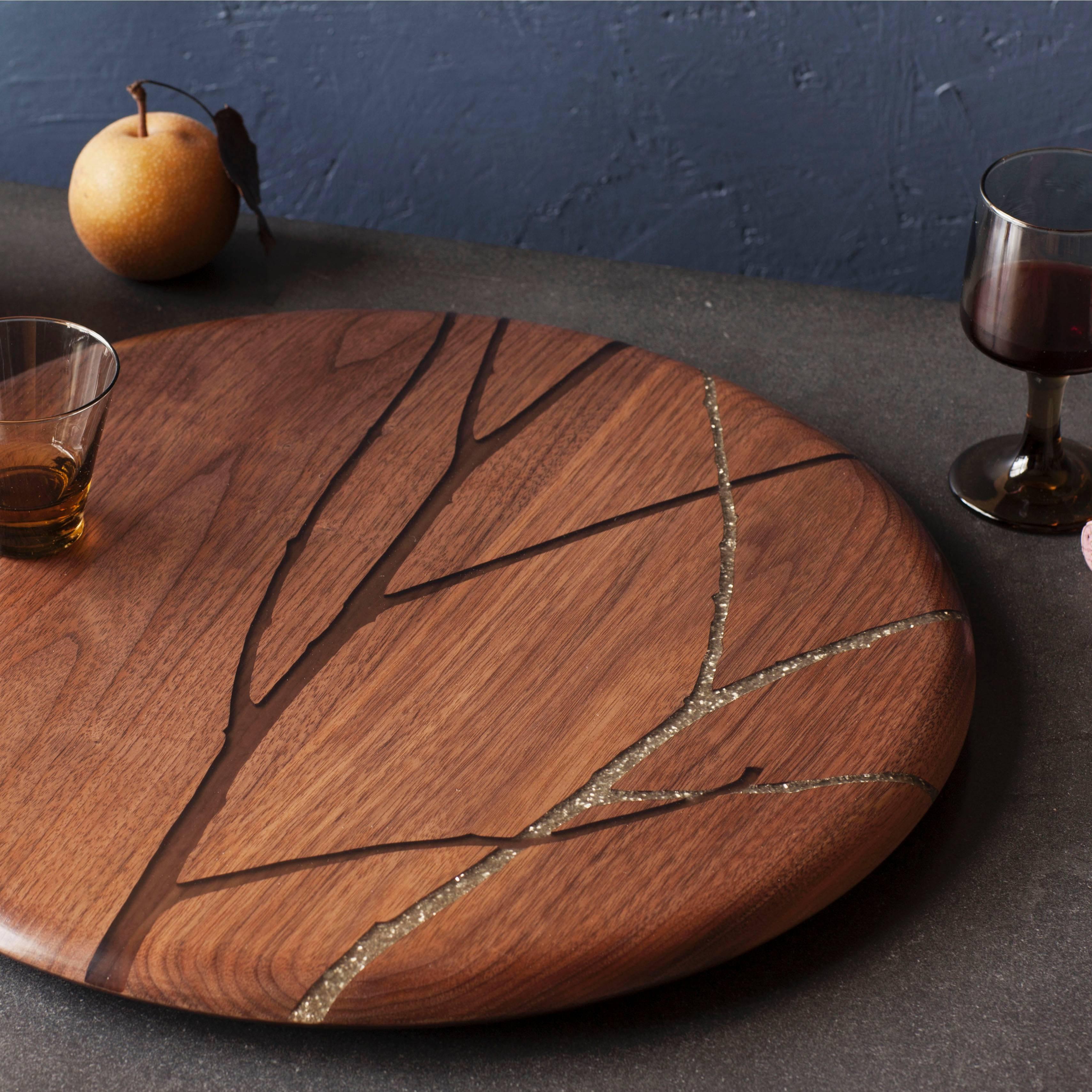 This low-profile tabletop turntable is not your Grandmother's lazy susan. 

The Hazy Floozan by Noble Goods is handmade from solid walnut and inlaid with epoxy resin over vintage glass glitter in our Sparklebranch design.

A beautiful centerpiece