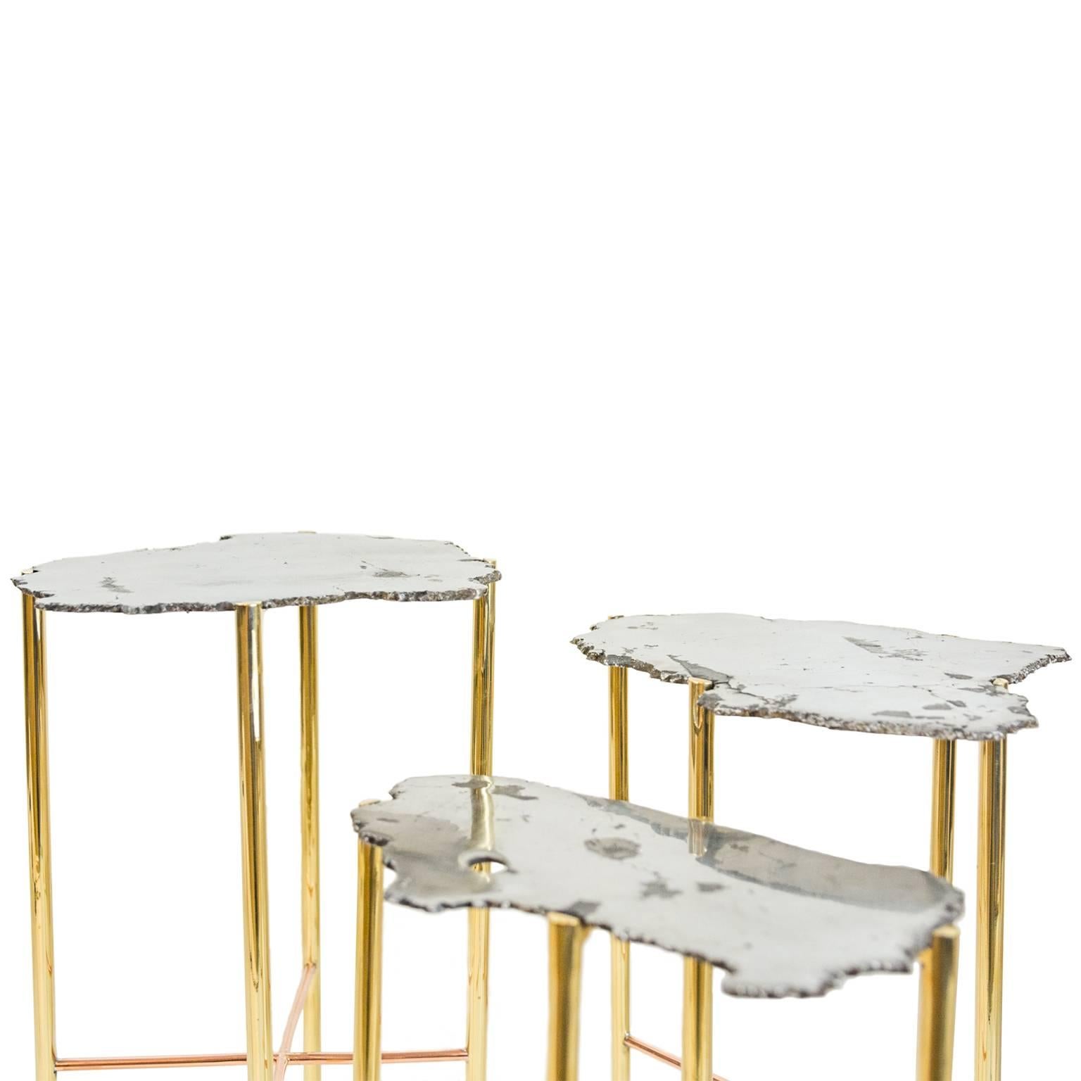 Christopher Kreiling cocktail table set with solid brass or copper legs, and table tops made from cross section of meteorite.


Set of three; measure: 18 H, 19 H, 20 H, dimensions variable. Diameter variable.