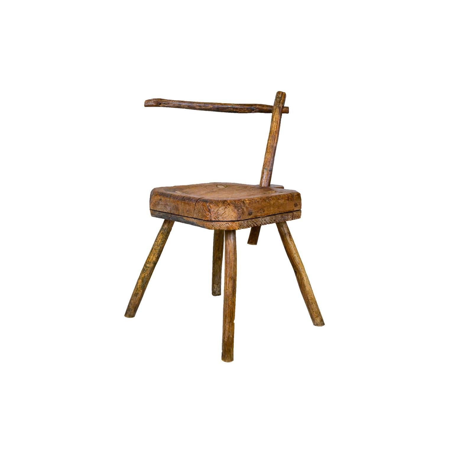 Hand-whittled wooden midwife stool from 19th century. The pivoting arm was used to drape cloths to assist the midwife. 

         