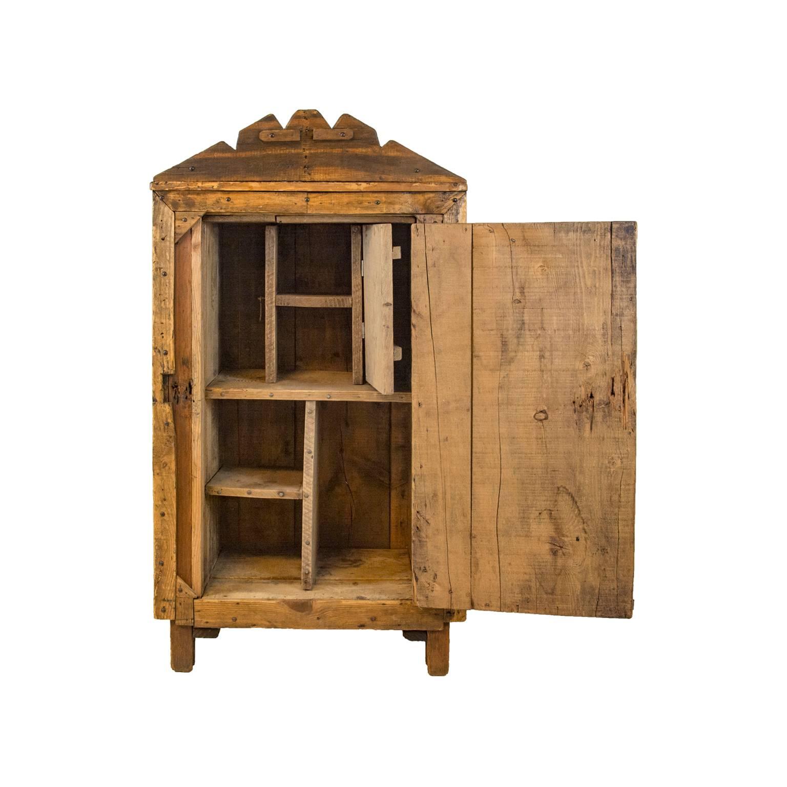 Antique Folk Art wood letter chest with hinged front door, divided top and bottom compartments. Small hinged door in centre of second shelf compartment.

Dimensions: 22.5 D x 14.5 W, 37 H at the top of the chest, and extends to 42 H via an