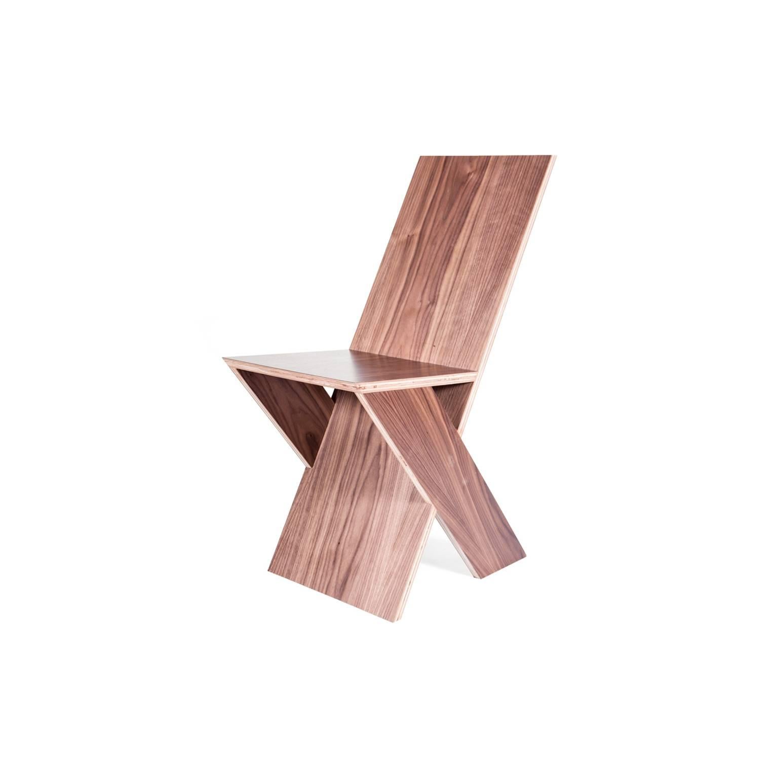 Plank side chair by Michael Boyd for PLANEfurniture. Offered here in zebrawood. From the PLANE series. 

The PLANKseries is the most uncompromising. Four flat planes are invisibly joined to create a chair that is elemental as a child's drawing.