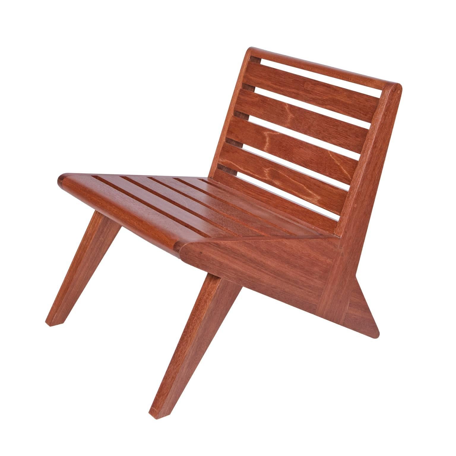 Arrowhead lounge chair by Michael Boyd for PLANEfurniture. Offered here in mahogany, with a small cowhide cushion. From the wedge series. 

The wedge series has a softer, more traditional character and may see wider distribution as a result.