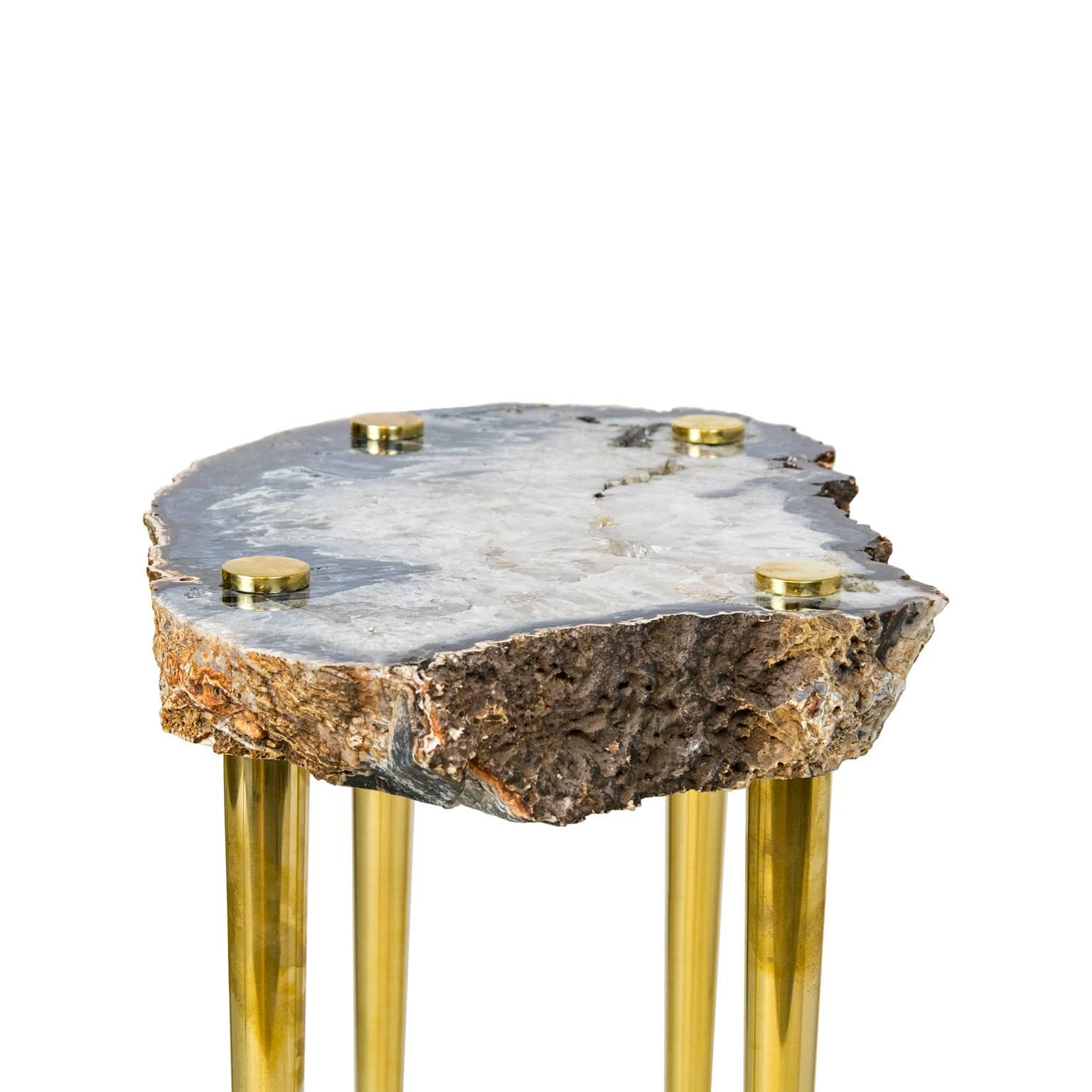 'Power of 10' Side Table in Quartz and Sold Brass by Christopher Kreiling

Zoom in and get lost in the beauty of this high-polished natural quartz crystal slab tabletop that been pieced with solid brass turned legs. The stone looks like an image