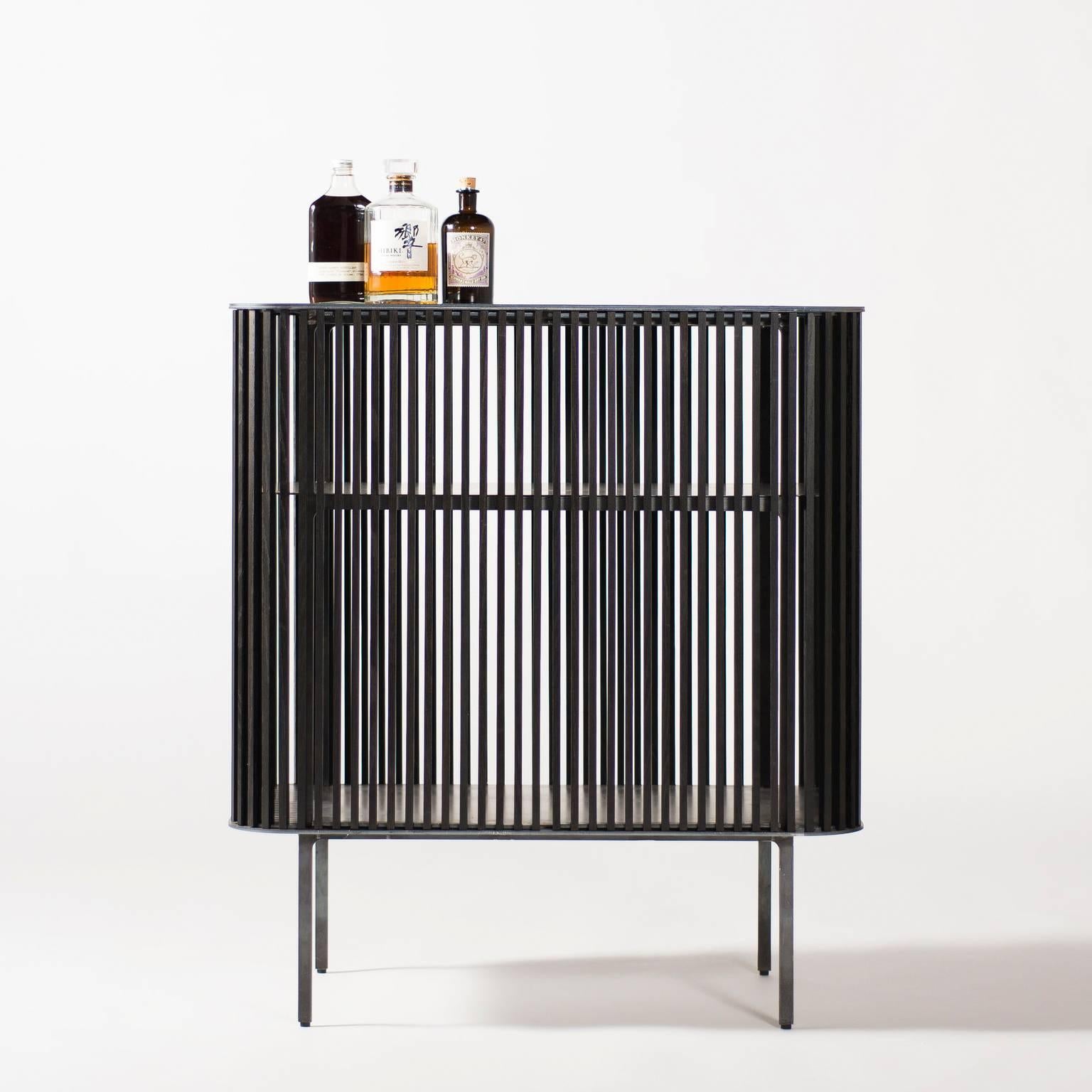 Bar by Klein Agency.

A beautiful contemporary bar in wood, leather, and steel. 

Be it in the gentleman’s corner of your apartment or center stage in your living room, the Bar in its simplicity, serves as a humble vessel for your most precious